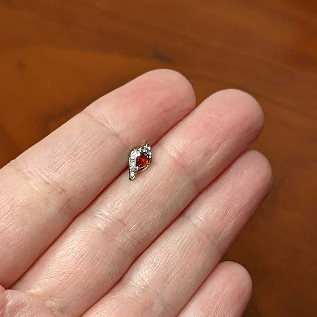 BodyCandy 16G 1/4 Clear Red Gem Swirling Oval Labret Monroe Tragus — back view