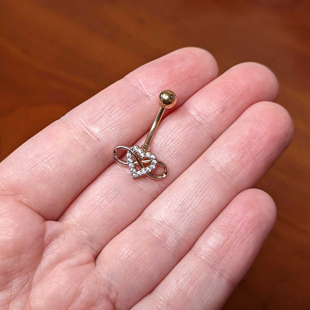 BodyCandy Clear Cubic Zirconia Gem Rose Gold Tone Infinity Heart Belly Ring — lifestyle context