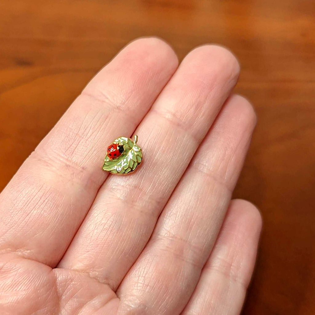 BodyCandy Clear Gem Gold Tone Leafy Ladybug Barbell Tongue Ring — back view