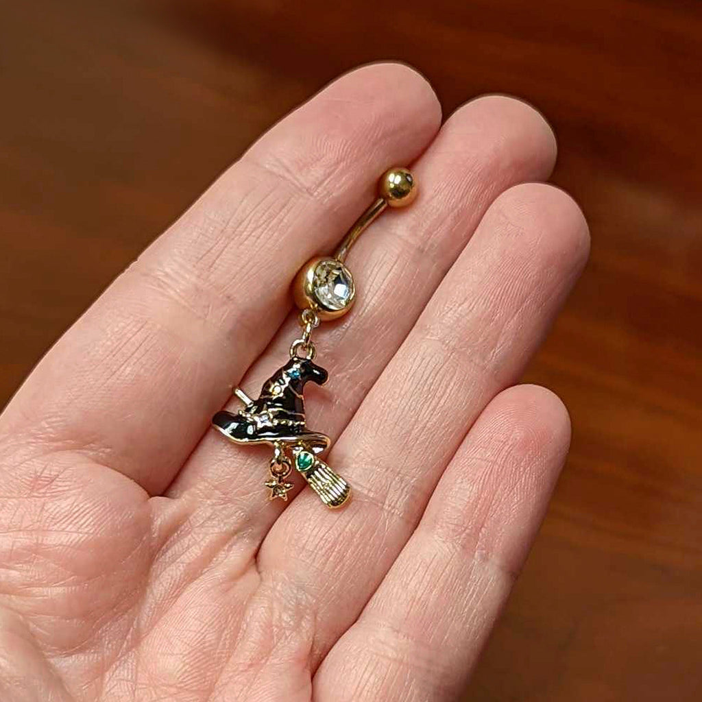BodyCandy Clear Green Gem Gold Tone Witch Hat Broom Halloween Dangle Belly Ring — lifestyle context