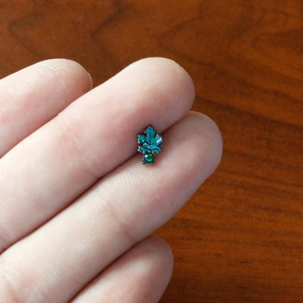 BodyCandy 16G 5/16 Green Synthetic Opal Black Fall Leaf Labret Monroe Tragus — in-use photo