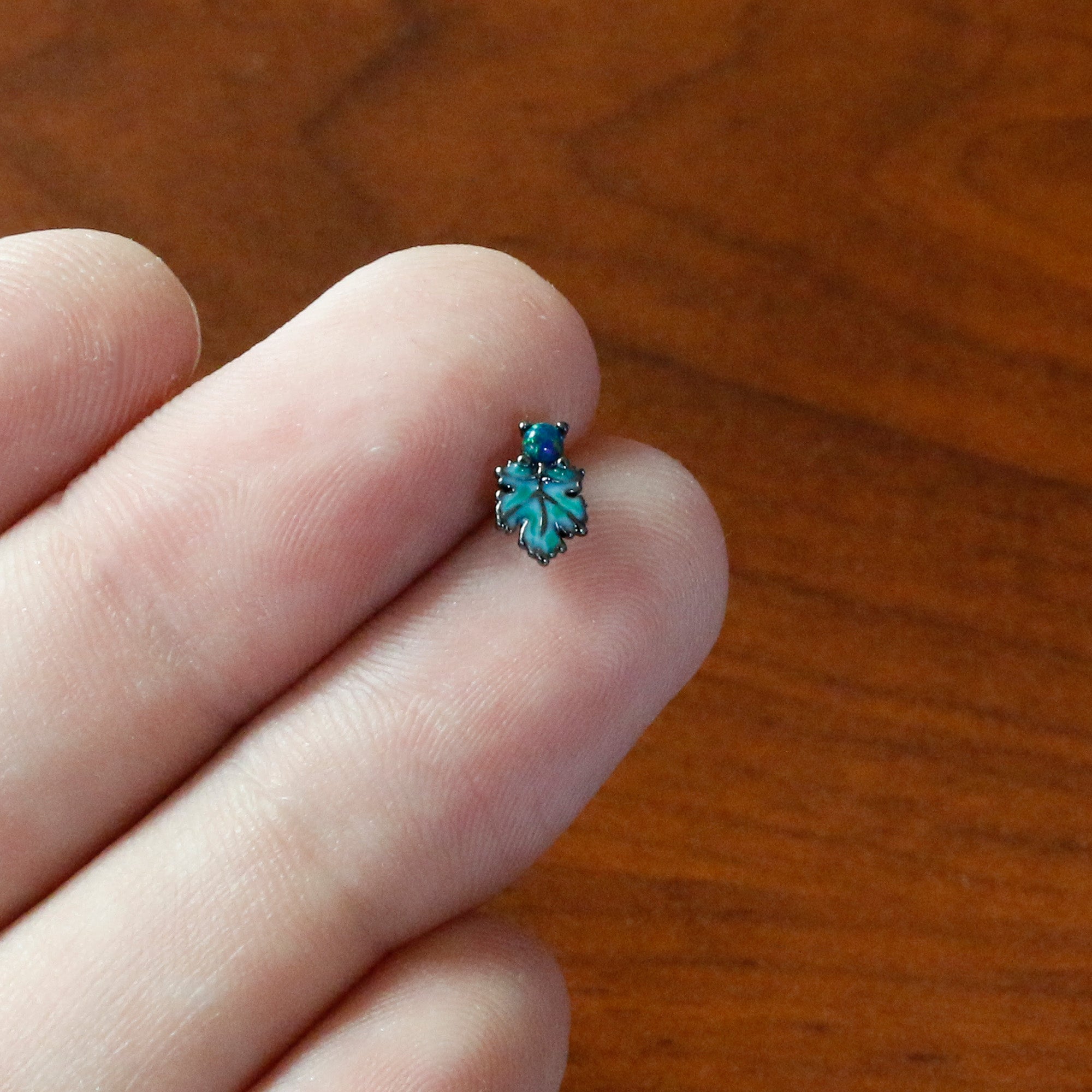 BodyCandy 20G 1/4 Green Synthetic Opal Fall Leaf Nose Bone — in-use photo