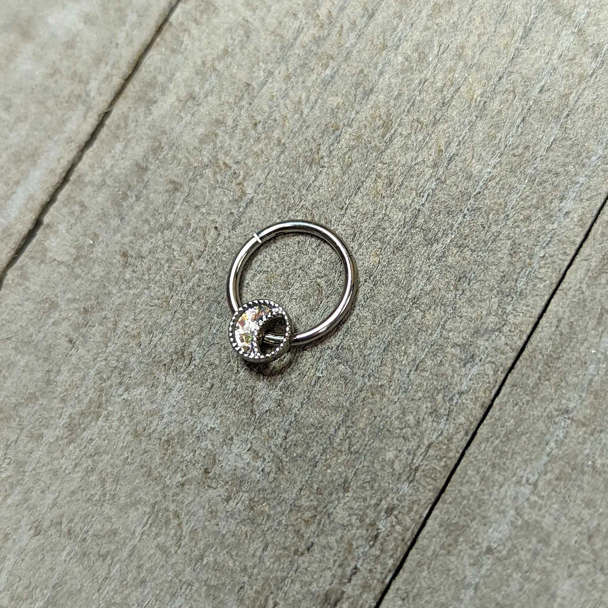 BodyCandy 16G 3/8 Iridescent Crescent Moon Hinged Segment Ring — in-use photo