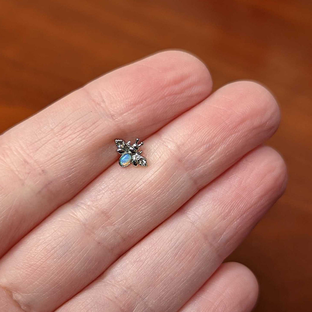 BodyCandy 20G 1/4 White Synthetic Opal Insect Nose Bone — back view
