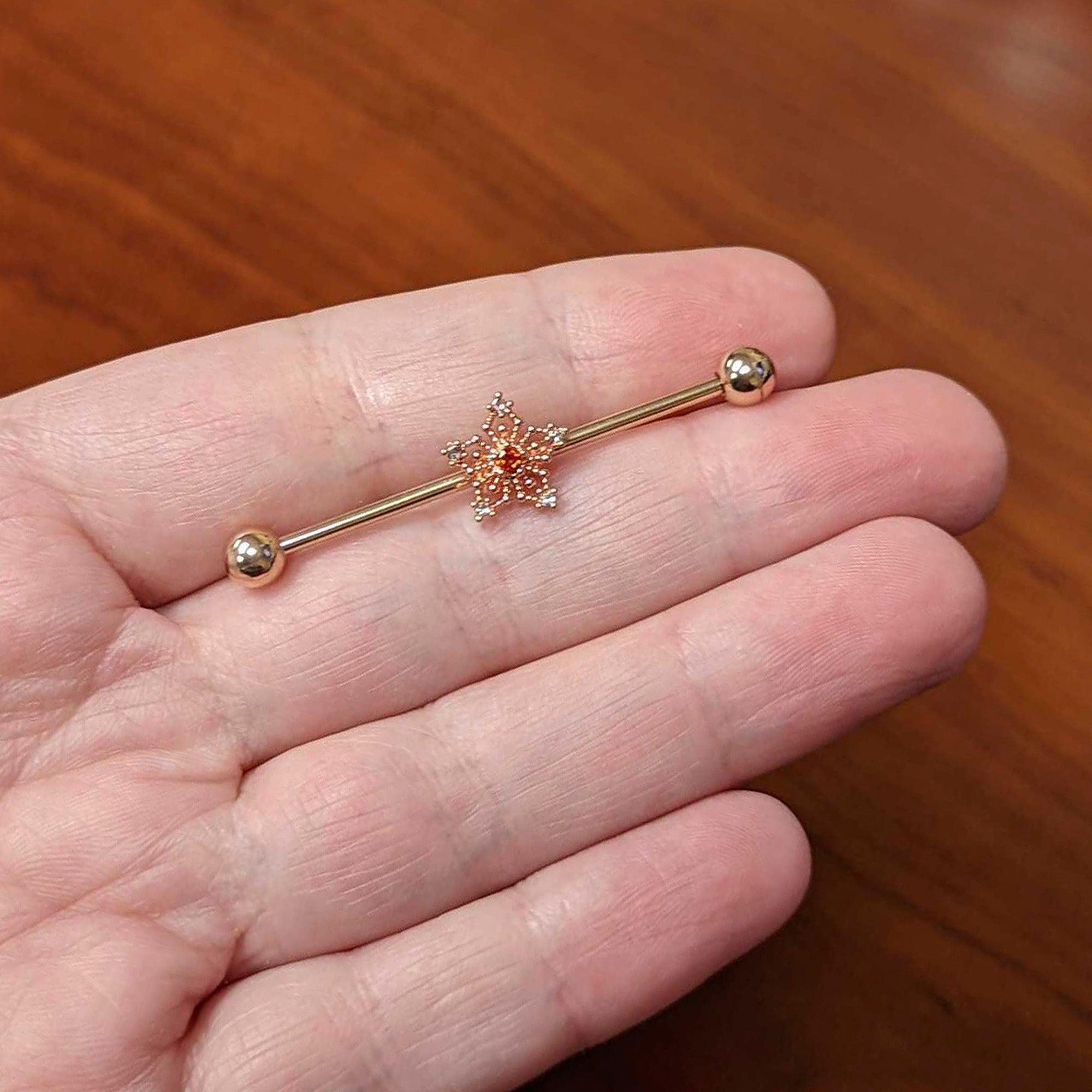 BodyCandy 14G Red Gem Rosy Tone Texture Snowflake Industrial Barbell 38mm — lifestyle context