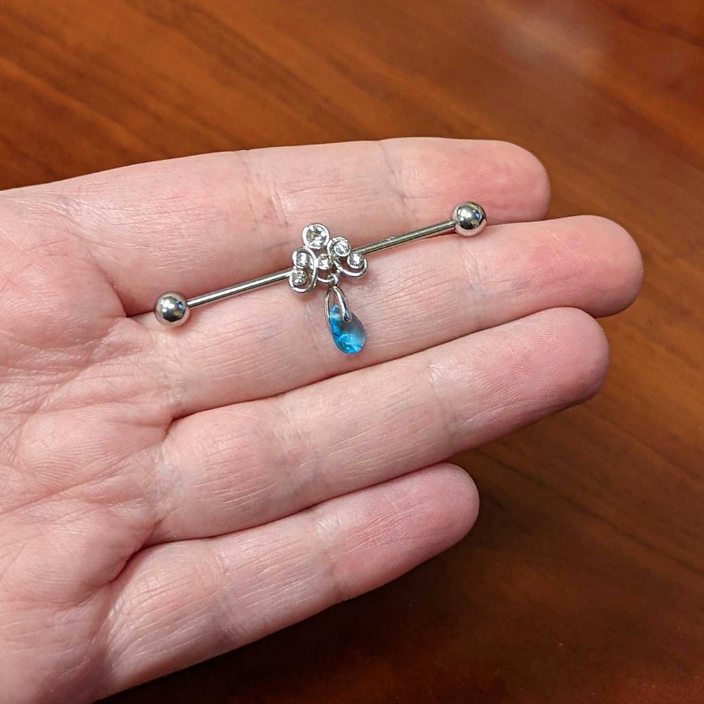 BodyCandy 14G Blue Gem Scrolling Elegance Dangle Industrial Barbell 38mm — lifestyle context