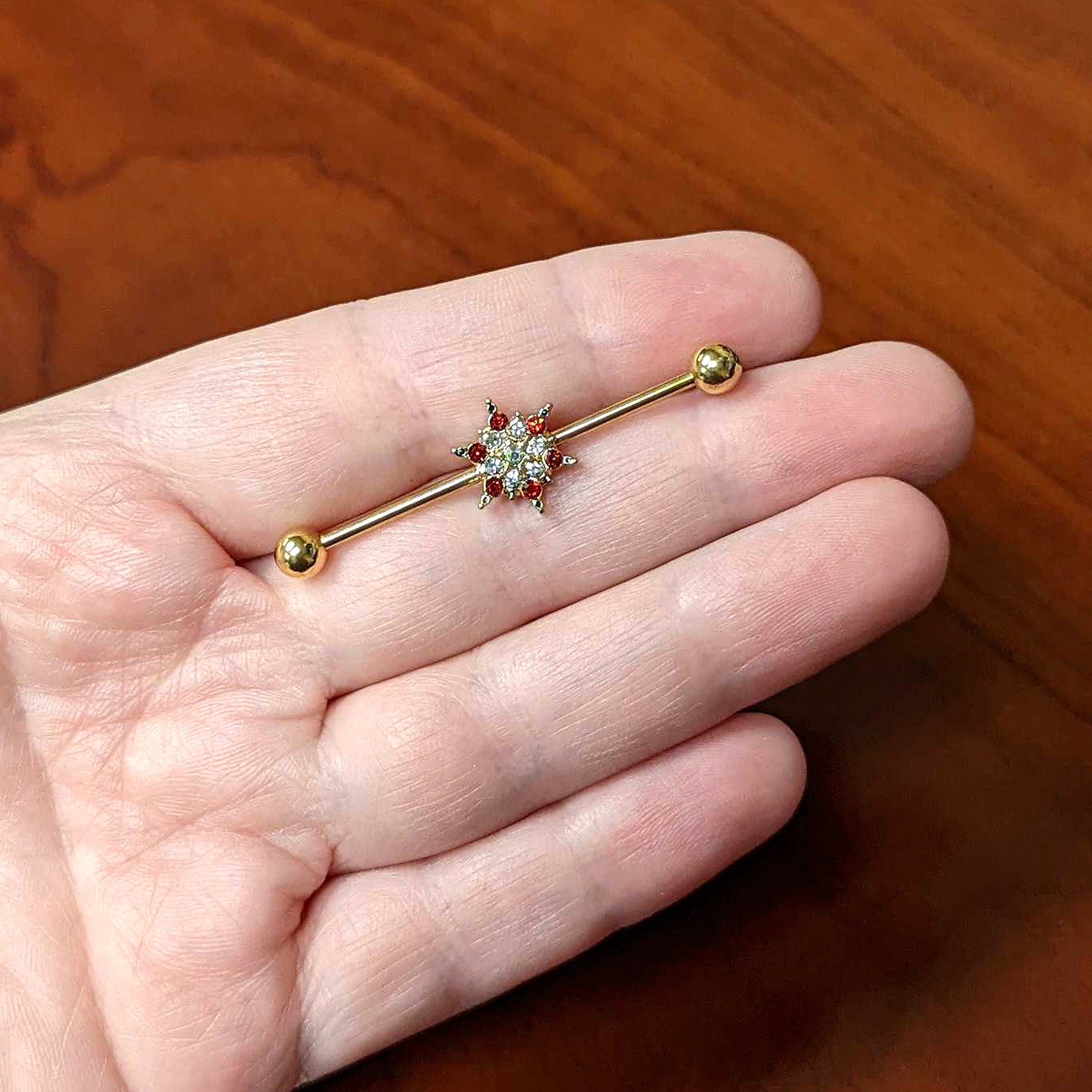 BodyCandy 14G Red Gem Gold Tone Bright Christmas Industrial Barbell 38mm — lifestyle context