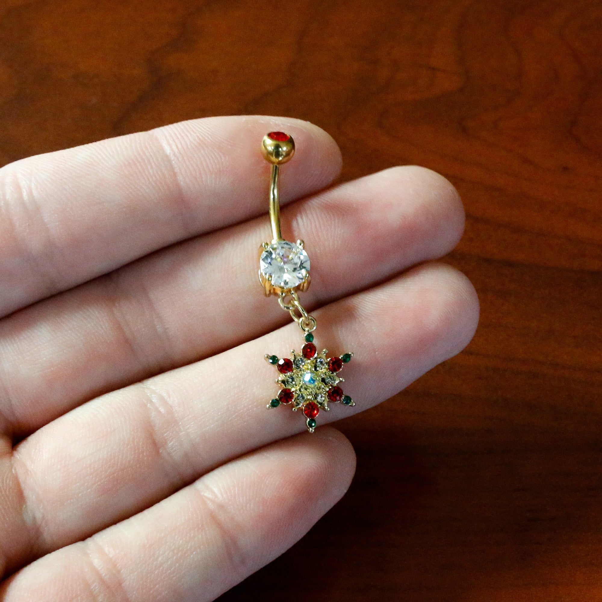 BodyCandy Aurora Red Green Gem Gold Tone Christmas Star Holiday Dangle Belly Ring — in-use photo