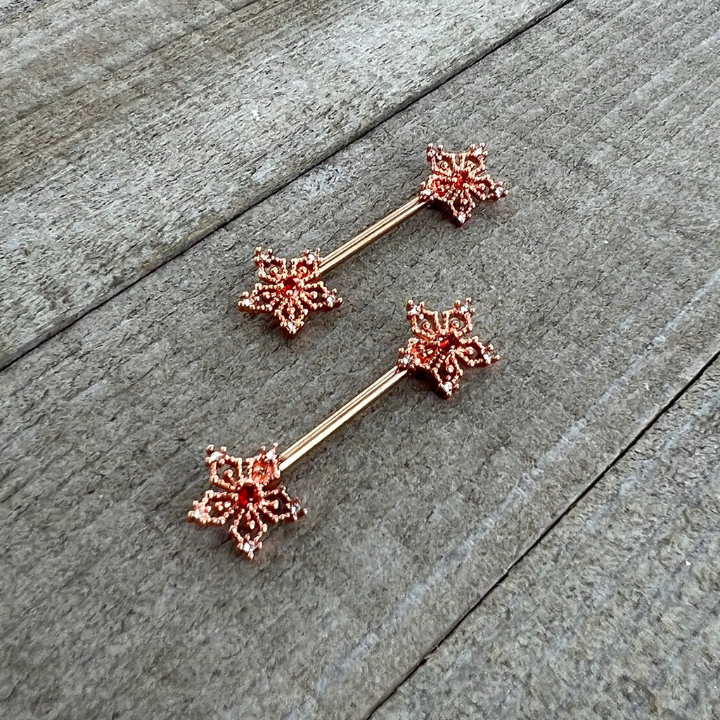 BodyCandy 14G 9/16 Red Gem Rosy Hue Texture Snowflake Barbell Nipple Ring Set — side view