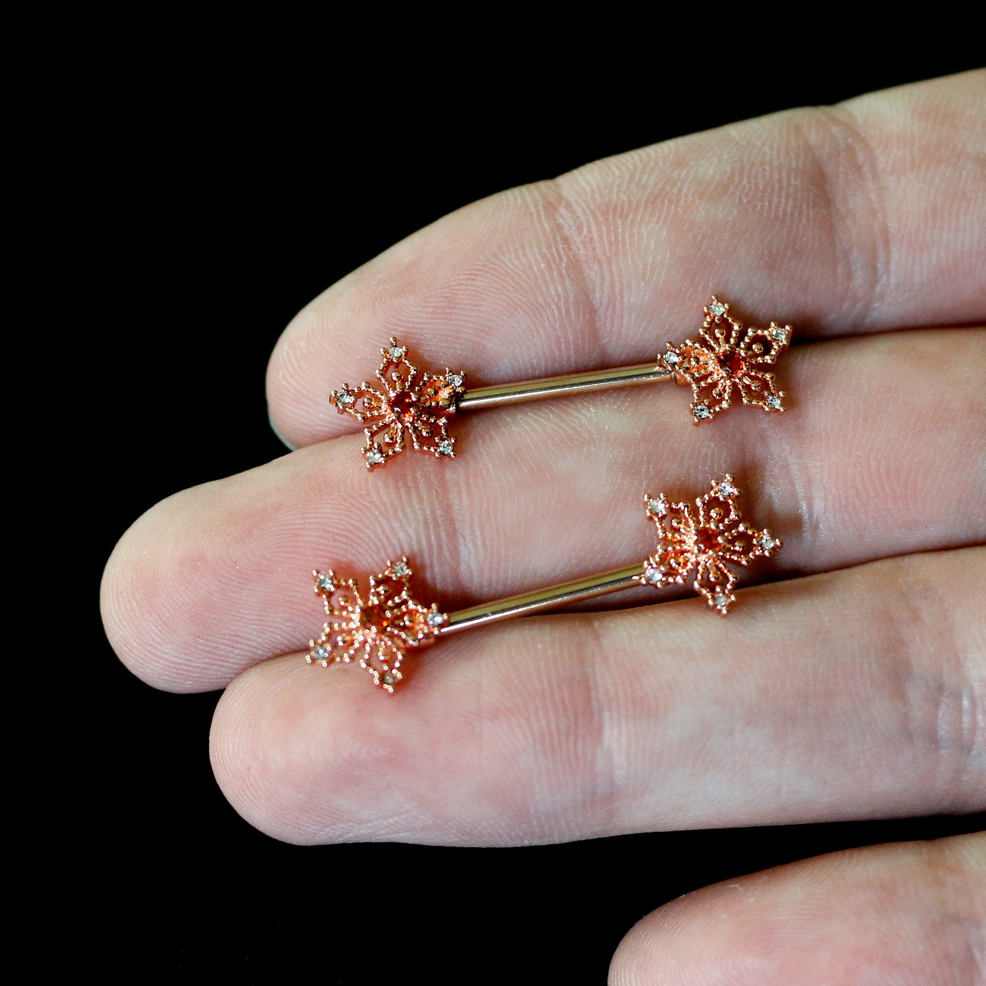 BodyCandy 14G 9/16 Red Gem Rosy Hue Texture Snowflake Barbell Nipple Ring Set — back view