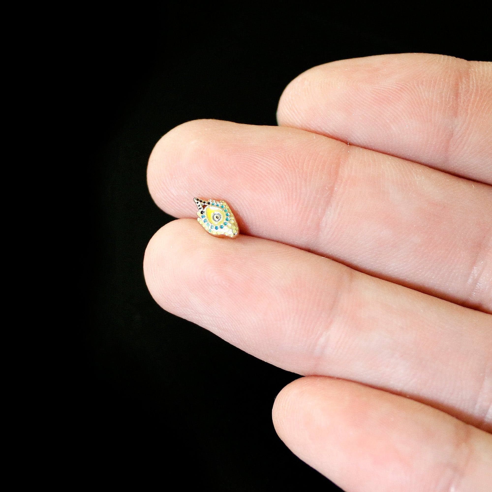 BodyCandy 16G 5/16 Gold Tone Bold Peacock Feather Labret Monroe Tragus — in-use photo