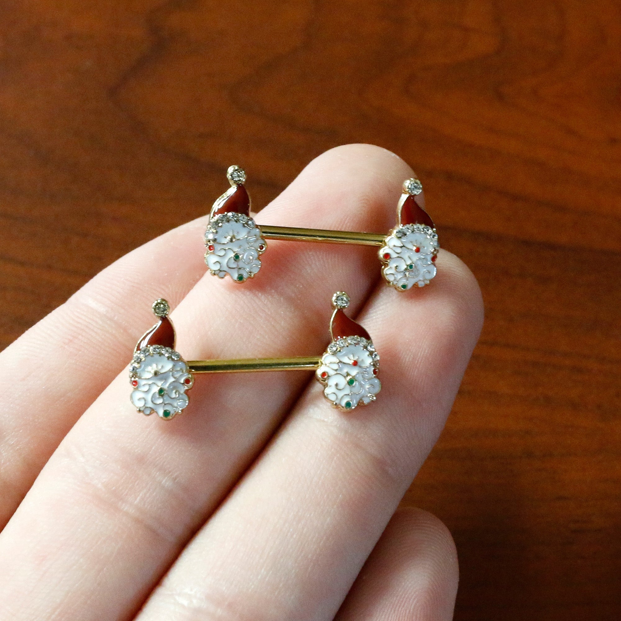 BodyCandy 14G 1/2 Clear Gem Gold Tone Decorated Santa Barbell Nipple Ring Set — in-use photo