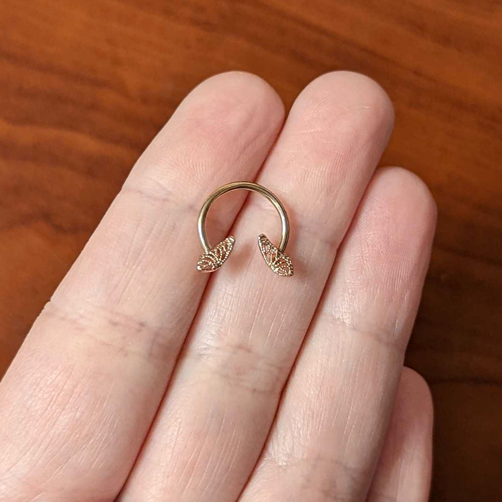 BodyCandy 16G 3/8 Rose Gold Hue Texture Butterfly Horseshoe Circular Barbell — side view