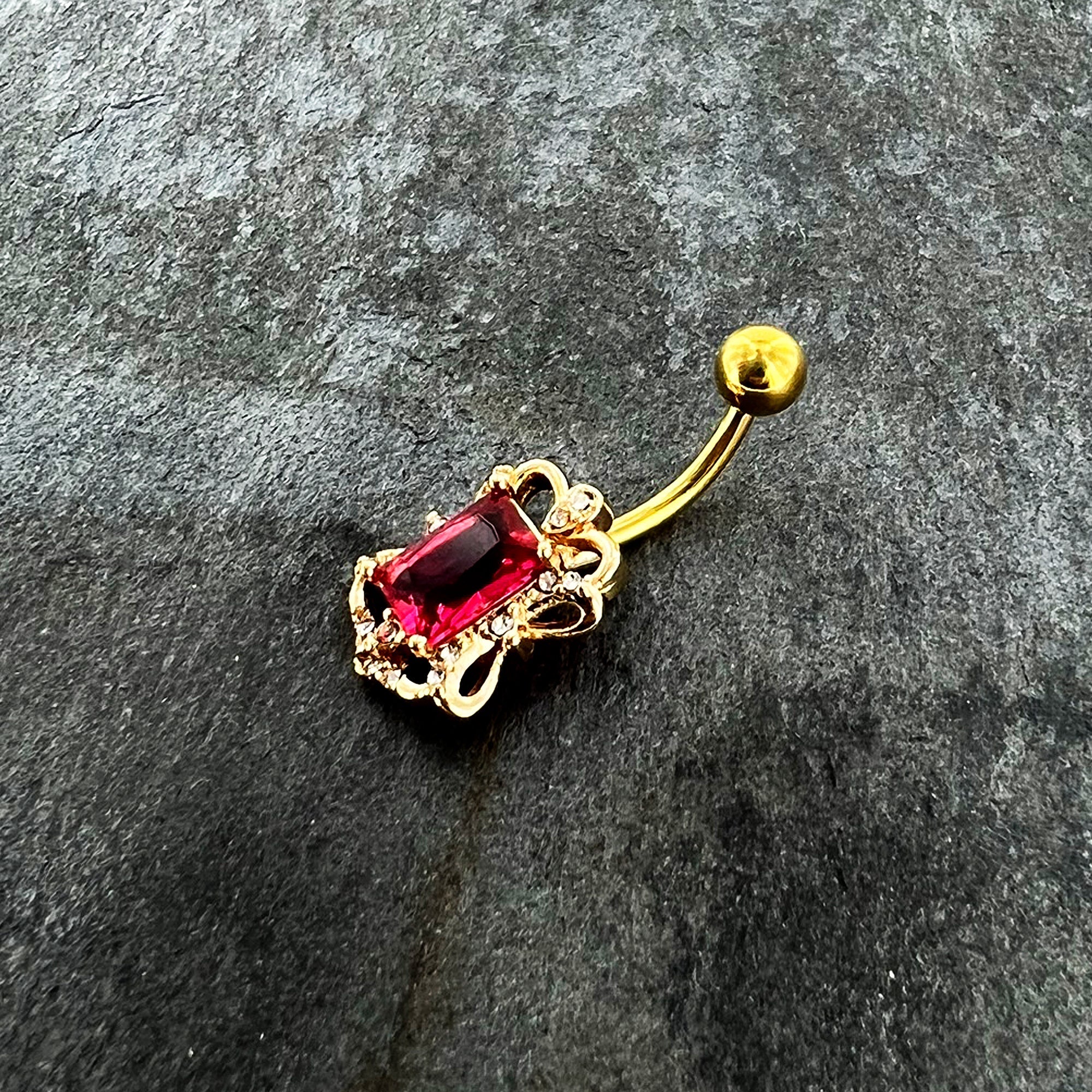 BodyCandy Clear Pink Gem Gold Tone Open Oblong Elegant Belly Ring — detail close-up