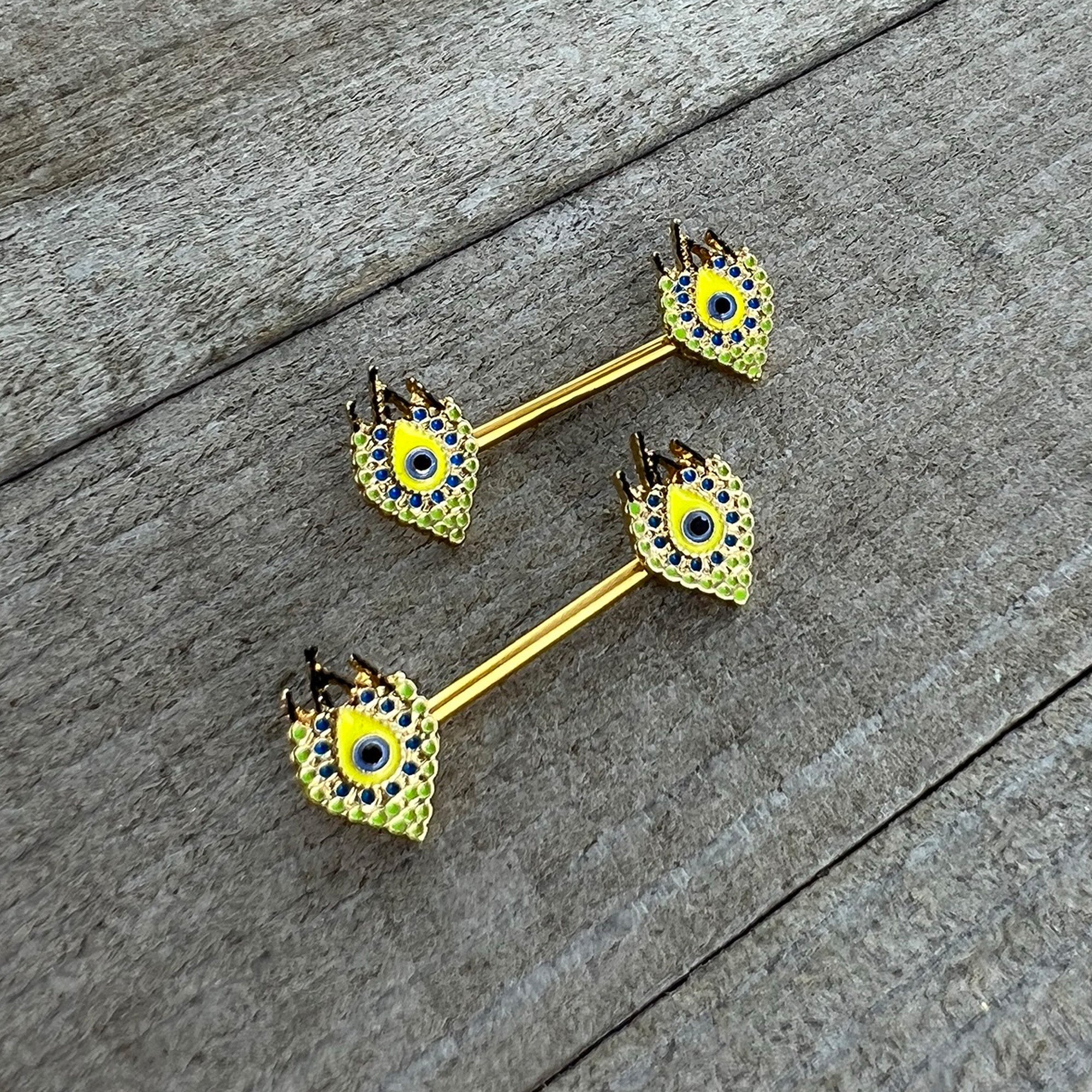 BodyCandy 14G 9/16 Gold Tone Bold Peacock Feather Barbell Nipple Ring Set — side view