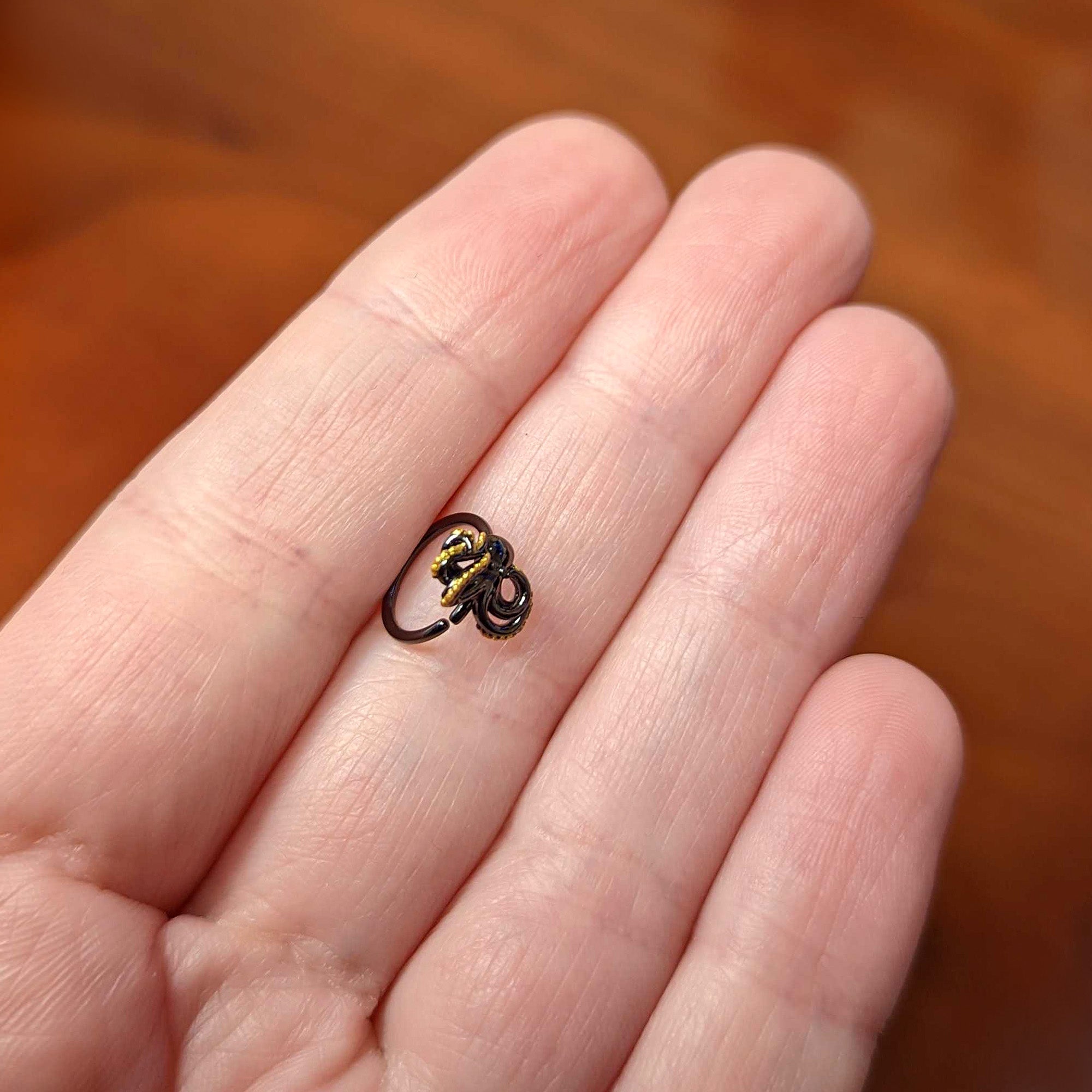 BodyCandy 20G 5/16 Black Understated Octopus Cartilage Closure Ring — back view