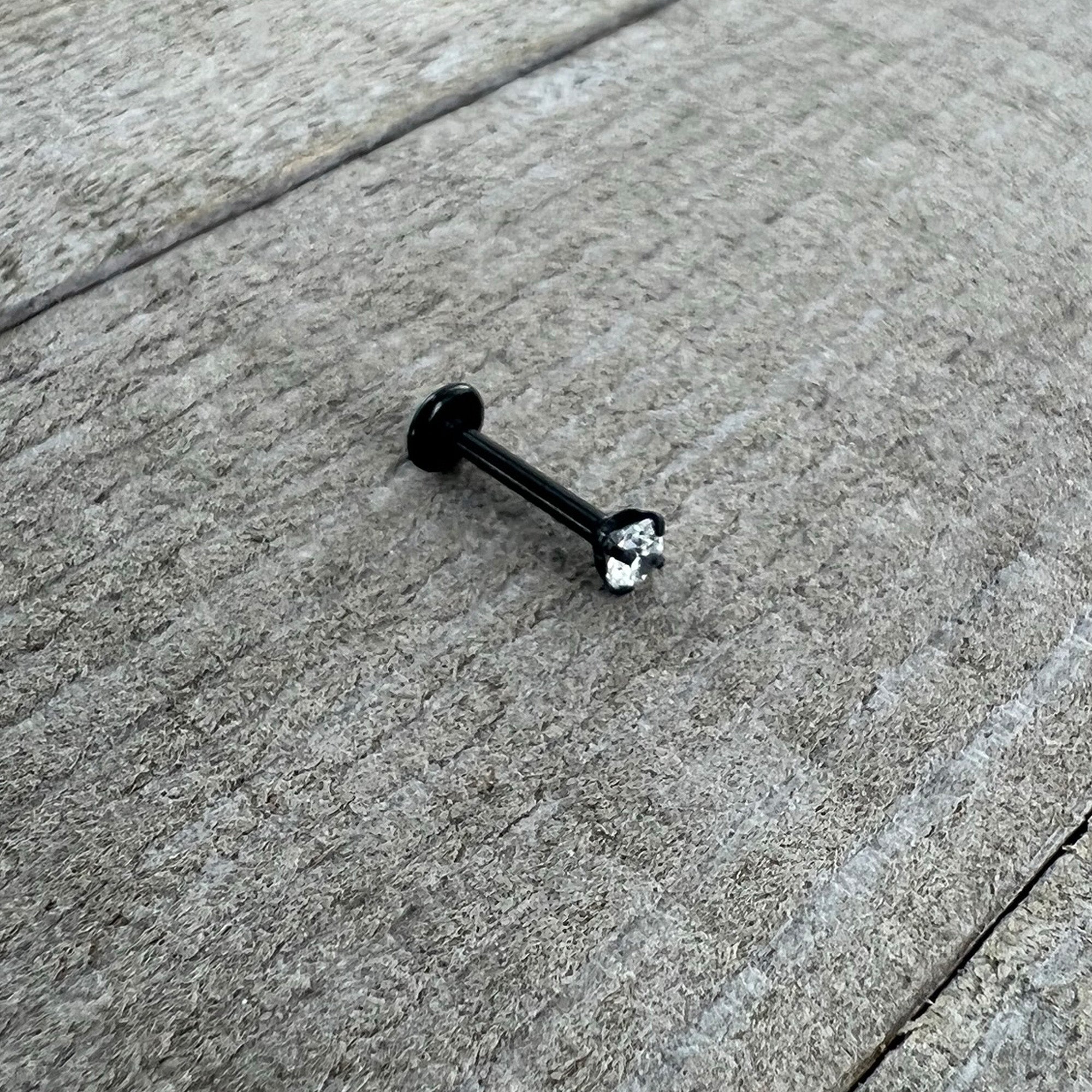 BodyCandy 16G 5/16 Clear Gem Black Round End Internally Threaded Labret Tragus — in-use photo