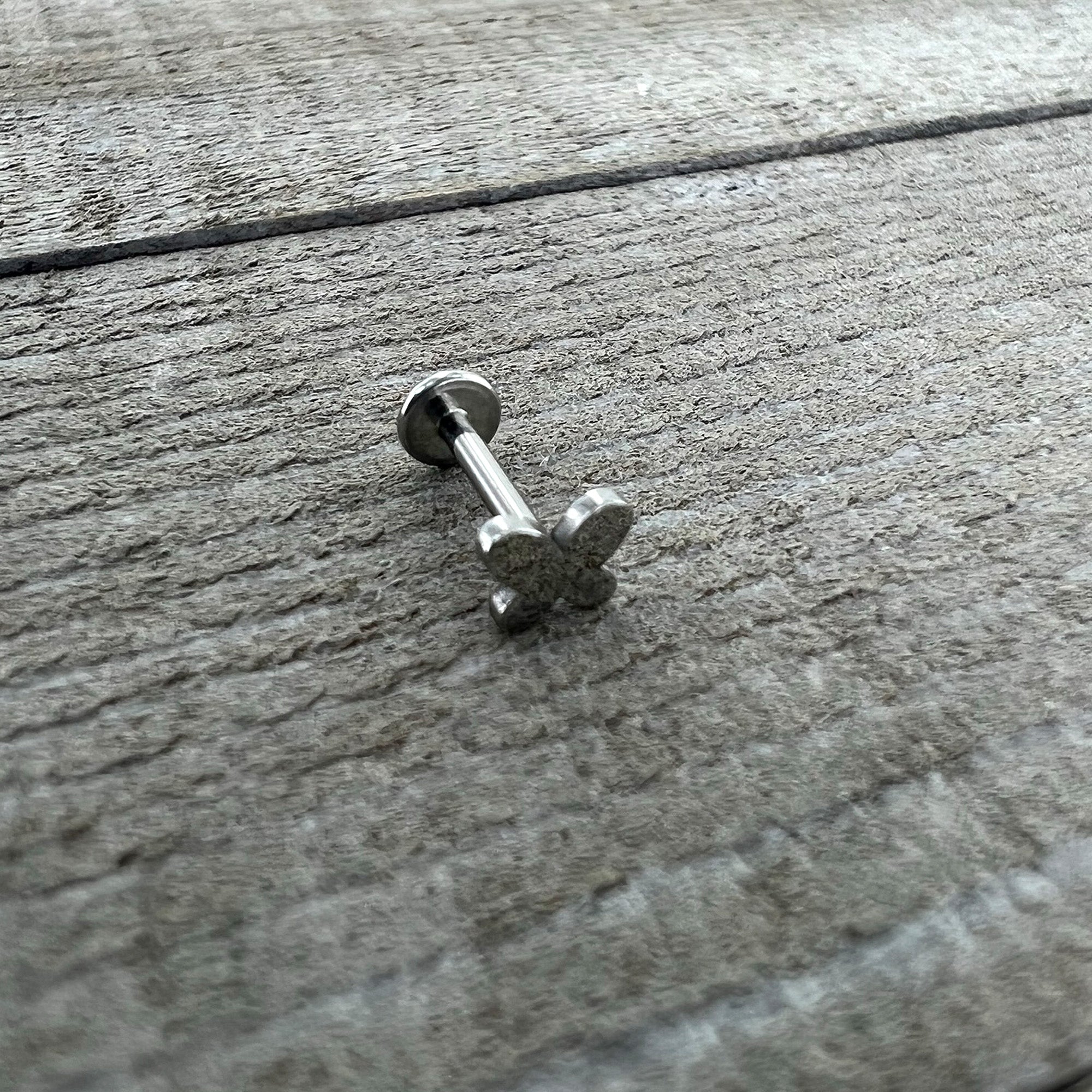 BodyCandy 16G 5/16 Simple Butterfly Internally Threaded Labret Monroe Tragus — in-use photo