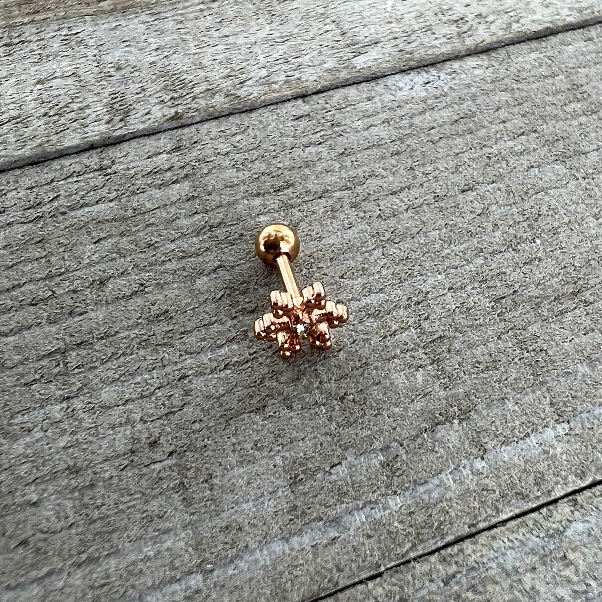 BodyCandy 16G 1/4 Clear Gem Rose Gold Tone Pretty Snowflake Cartilage Tragus — back view