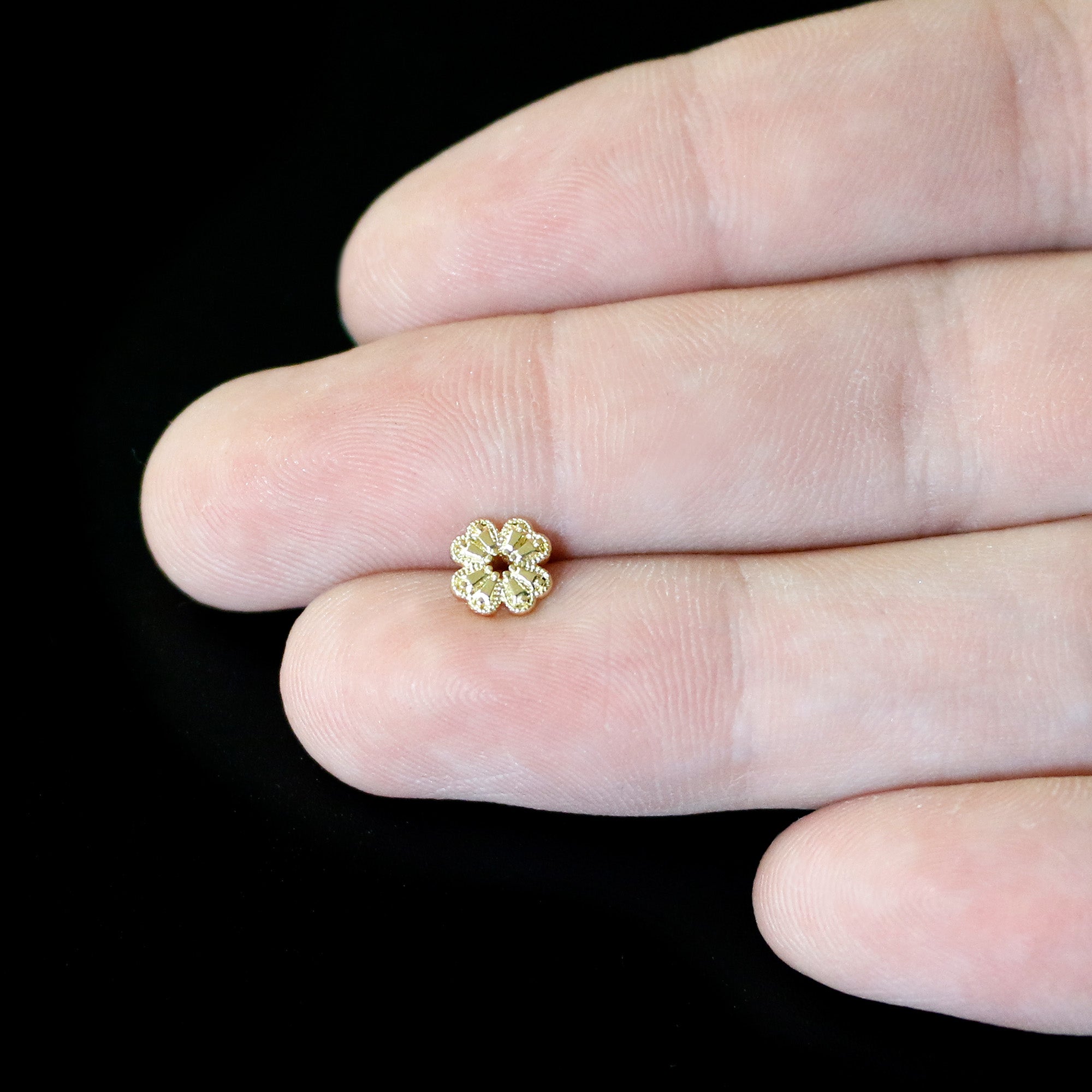 BodyCandy 20G 1/4 Yellow Gem Gold Tone Textured Cross Nose Bone — in-use photo