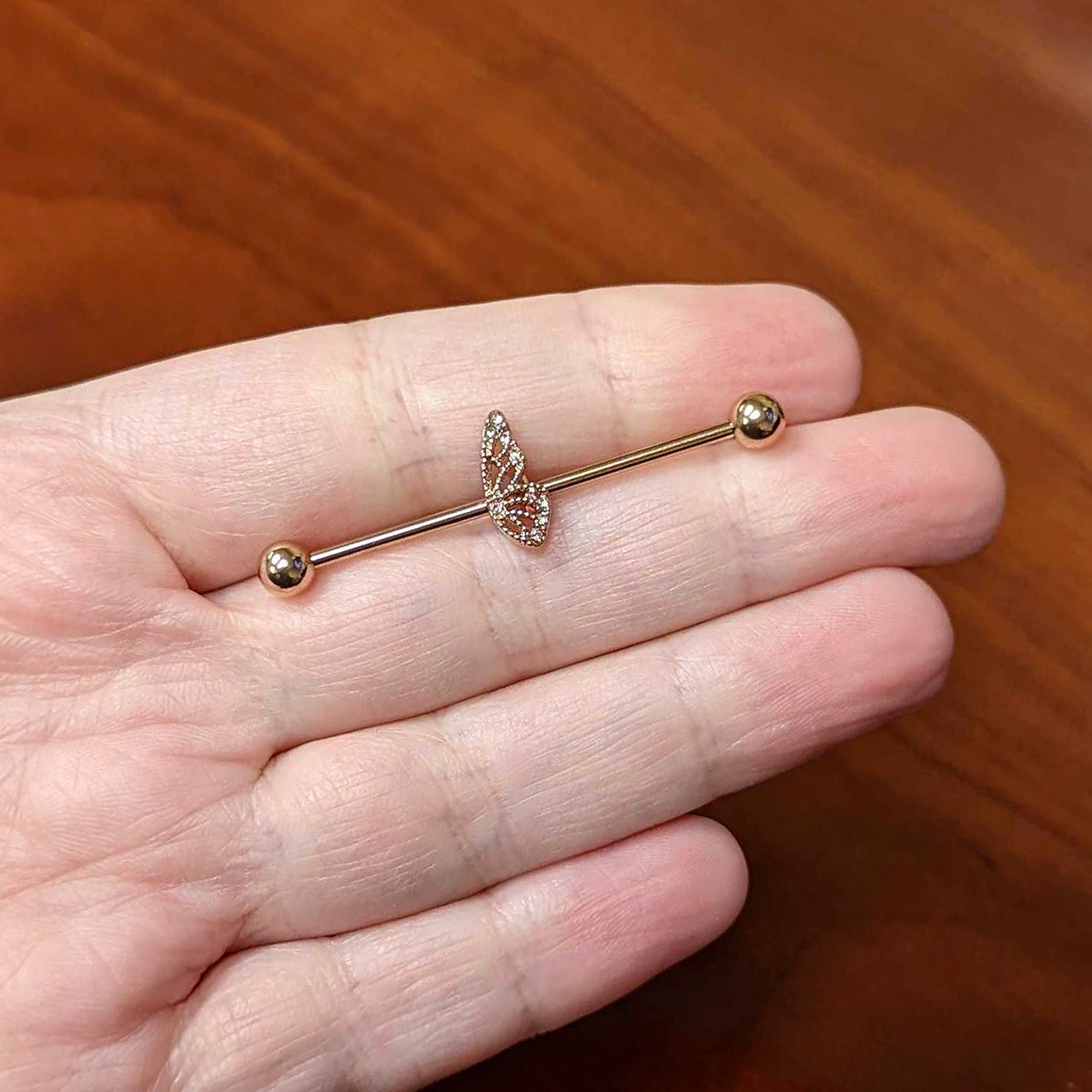 BodyCandy 14G Clear Gem Rose Gold Tone Texture Wing Industrial Barbell 38mm — lifestyle context