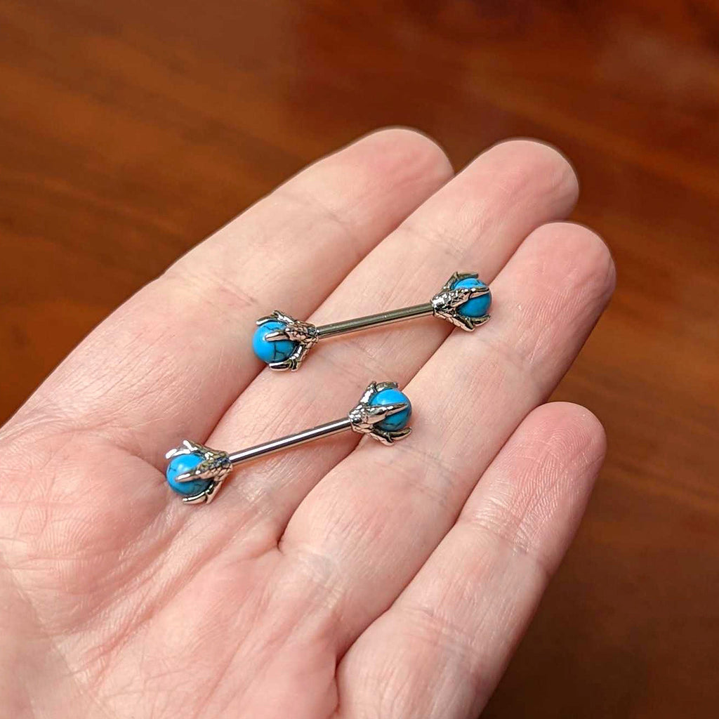 BodyCandy 14G 5/8 Blue Turquoise Skeleton Hand Halloween Nipple Ring Set — side view