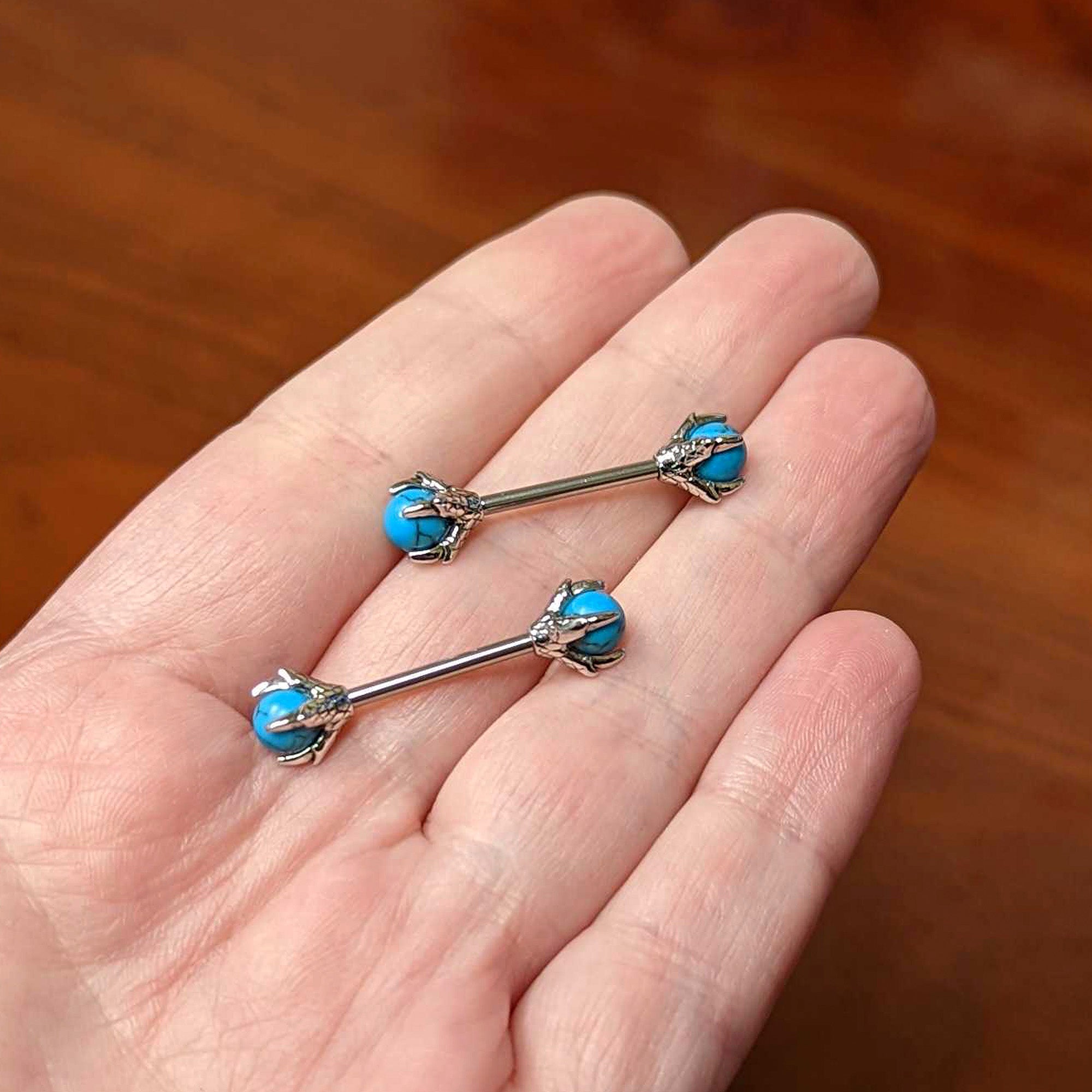 BodyCandy 14G 5/8 Blue Turquoise Skeleton Hand Halloween Nipple Ring Set — side view