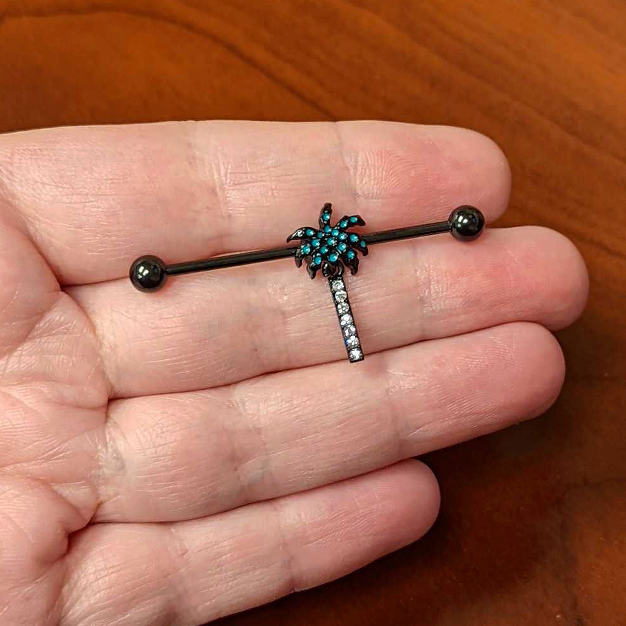 BodyCandy 14G Clear Gem Black Night Palm Tree Dangle Industrial Barbell 38mm — lifestyle context