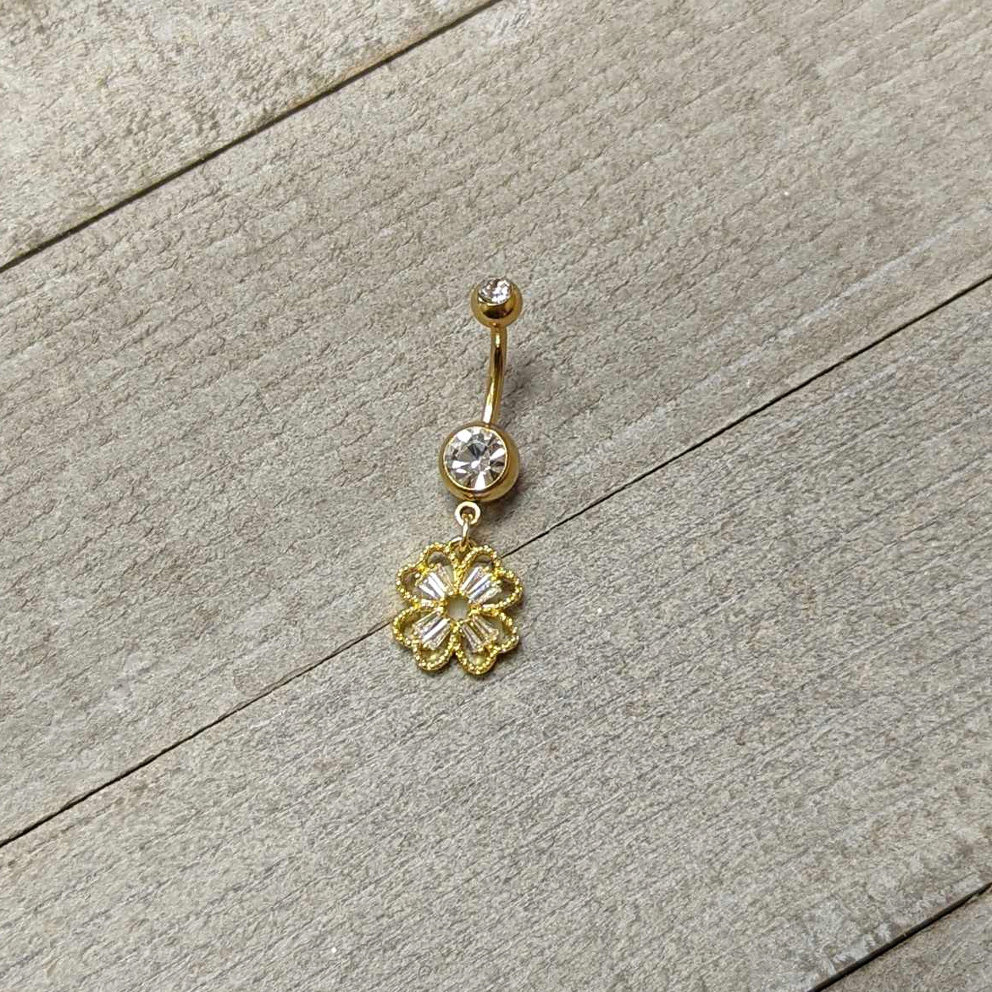 BodyCandy Clear Gem Gold Tone Elegant Textured Shamrock Dangle Belly Ring — side view