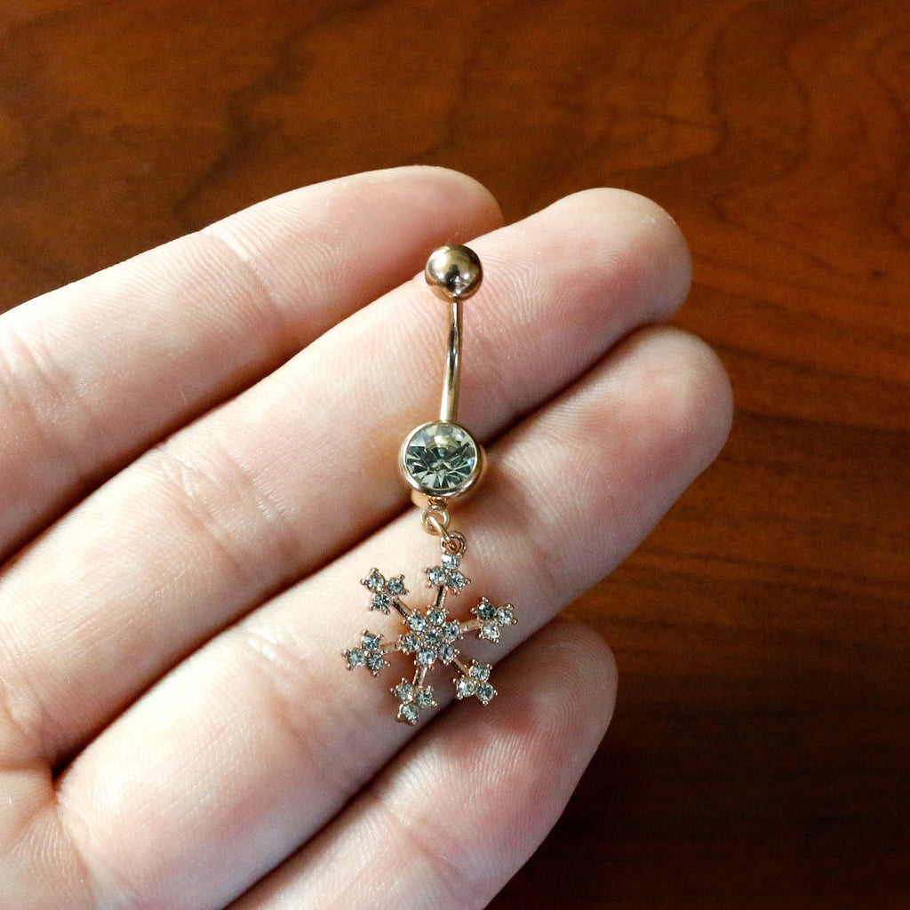 BodyCandy Clear Gem Rose Gold Tone Square Snowflake Holiday Dangle Belly Ring — in-use photo