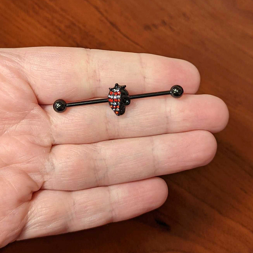 BodyCandy 14G Clear Red Gem Black Skull Halloween Industrial Barbell 38mm — lifestyle context