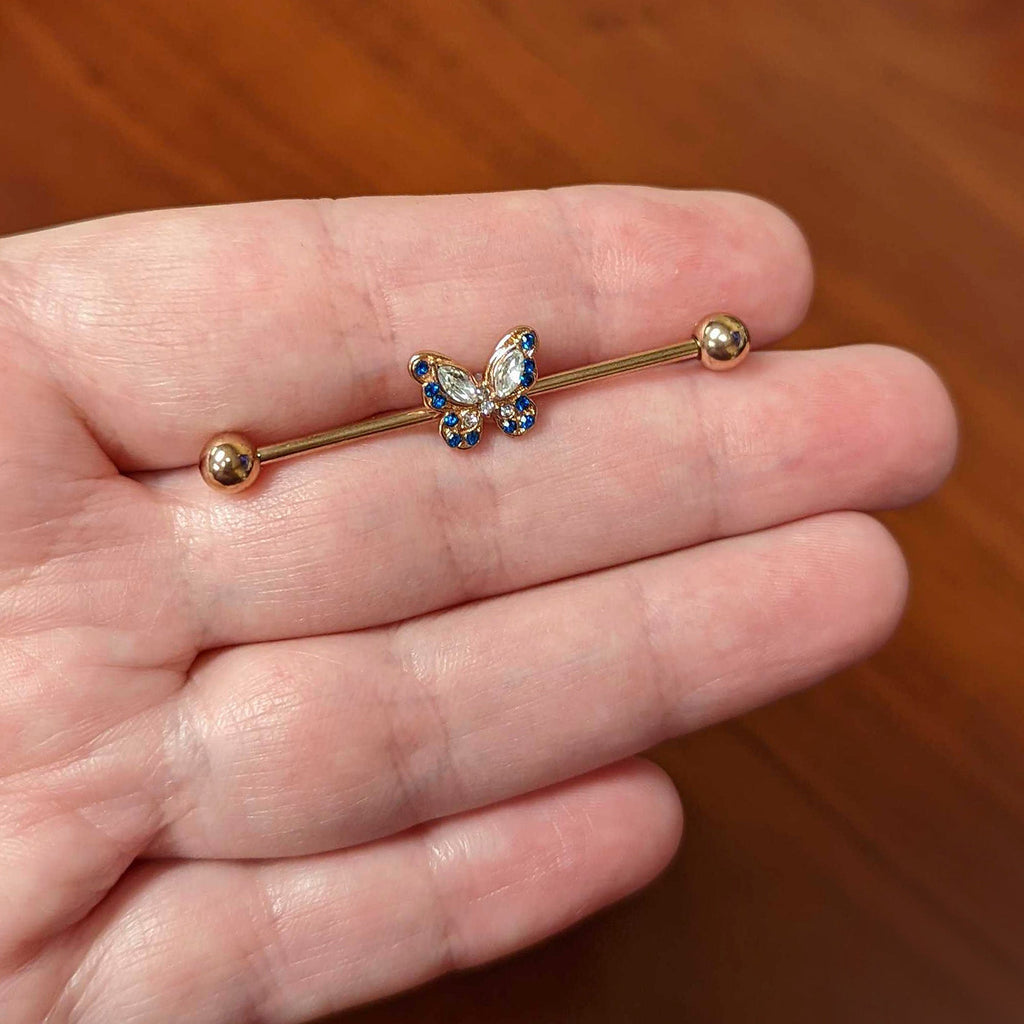 BodyCandy 14G Blue Gem Rosy Tone Butterfly Wings Industrial Barbell 38mm — lifestyle context