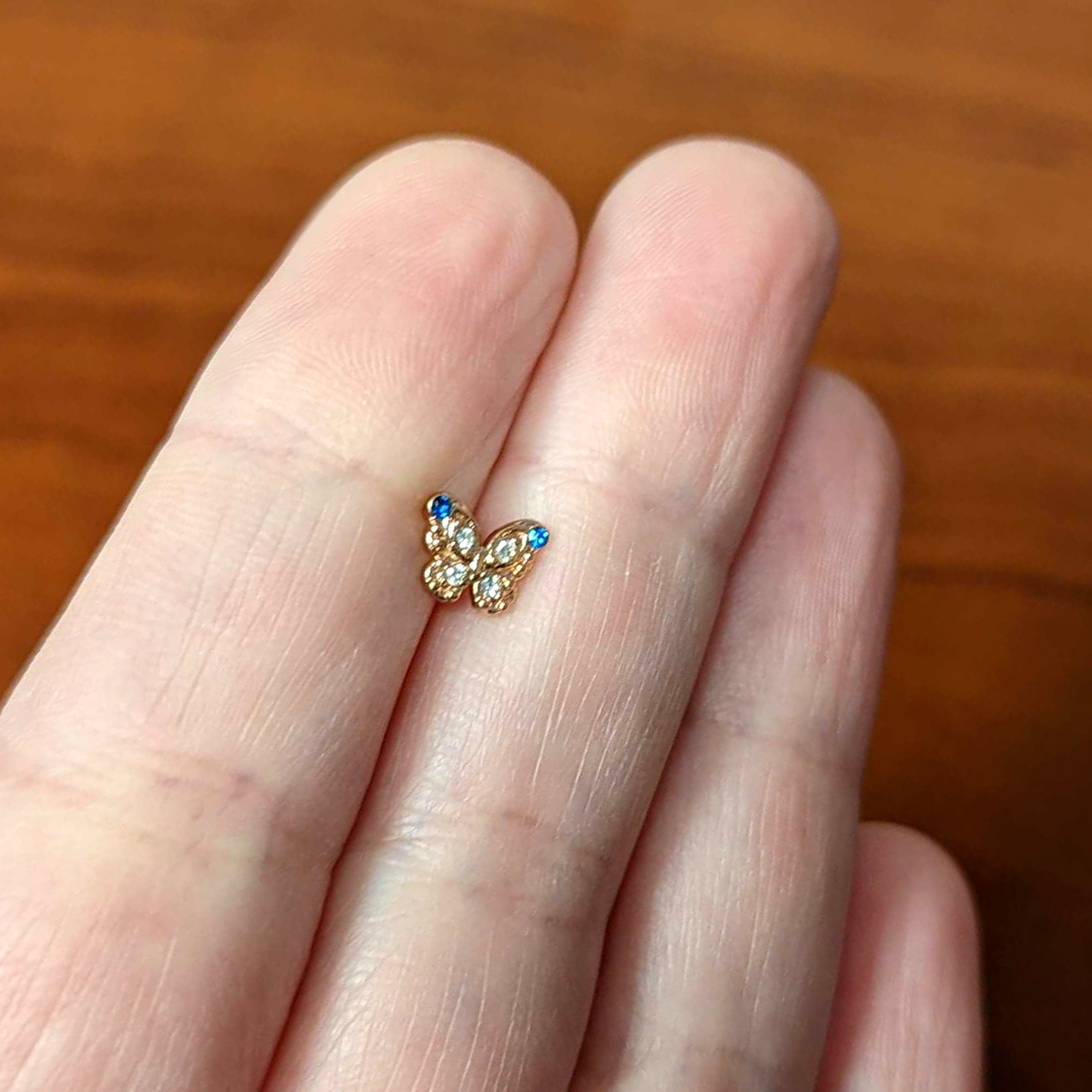 BodyCandy 16G 1/4 Blue Gem Rose Gold Tone Butterfly Cartilage Tragus — back view