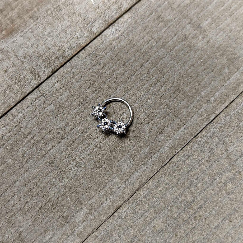 BodyCandy 16G 3/8 Clear Blue Gem Festive Trio Snowflake Hinged Segment Ring — side view