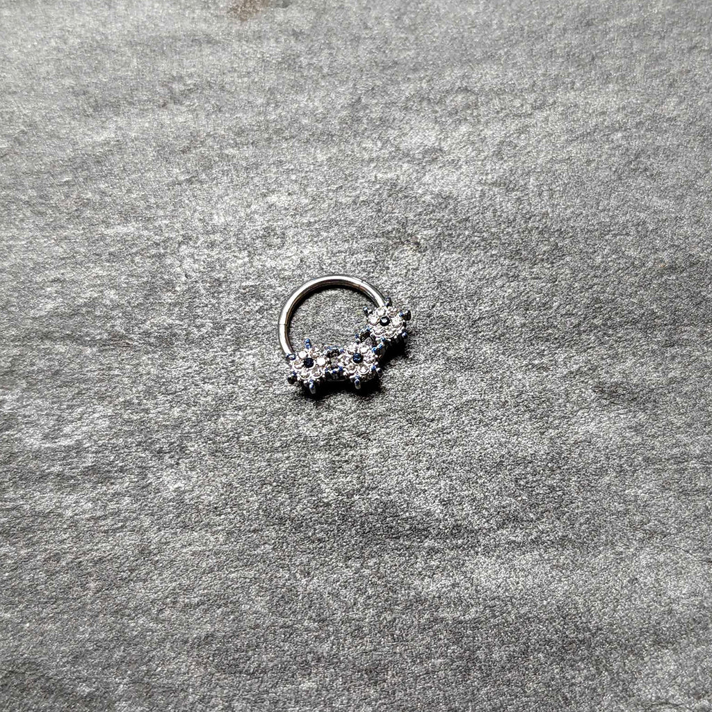 BodyCandy 16G 3/8 Clear Blue Gem Festive Trio Snowflake Hinged Segment Ring — back view