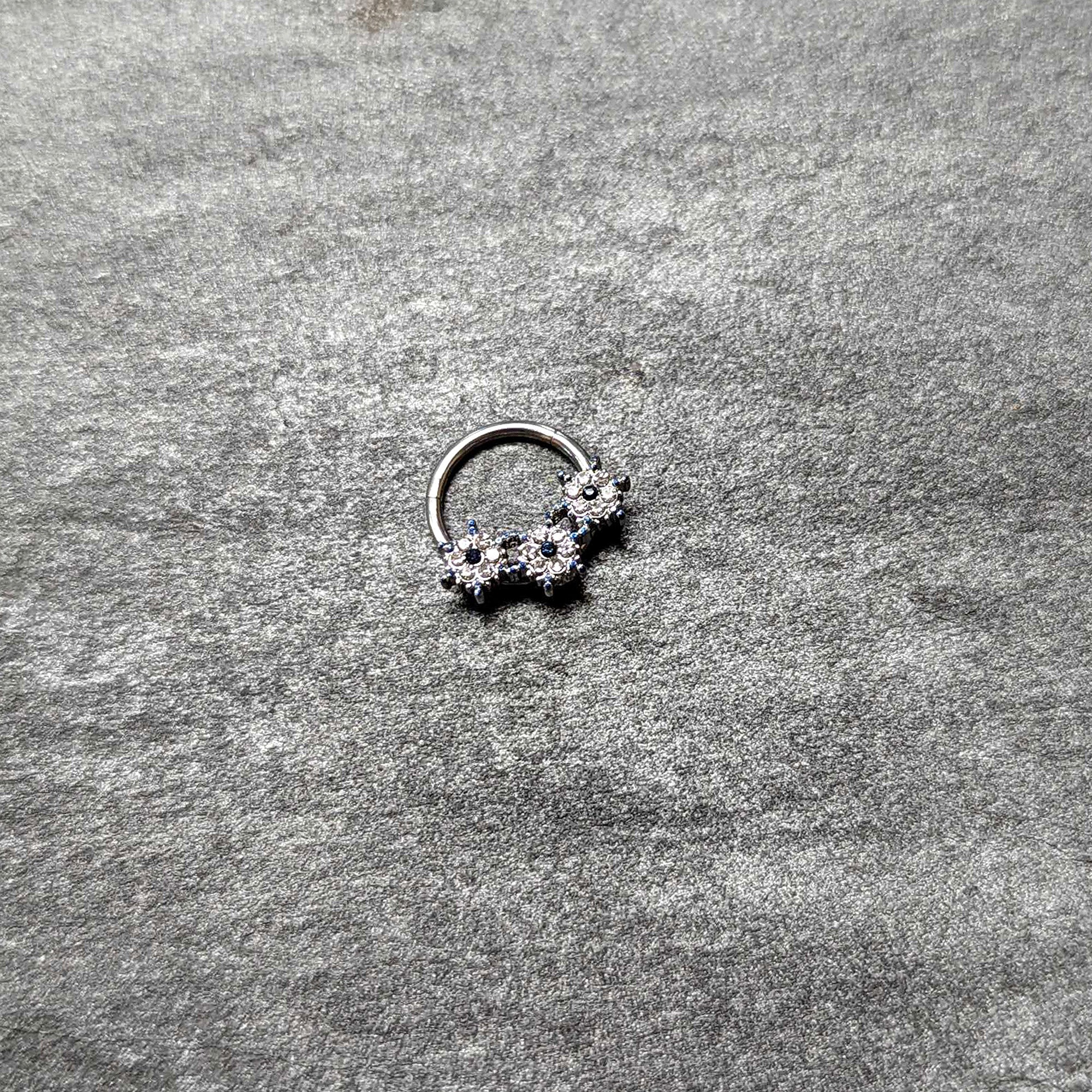 BodyCandy 16G 3/8 Clear Blue Gem Festive Trio Snowflake Hinged Segment Ring — back view