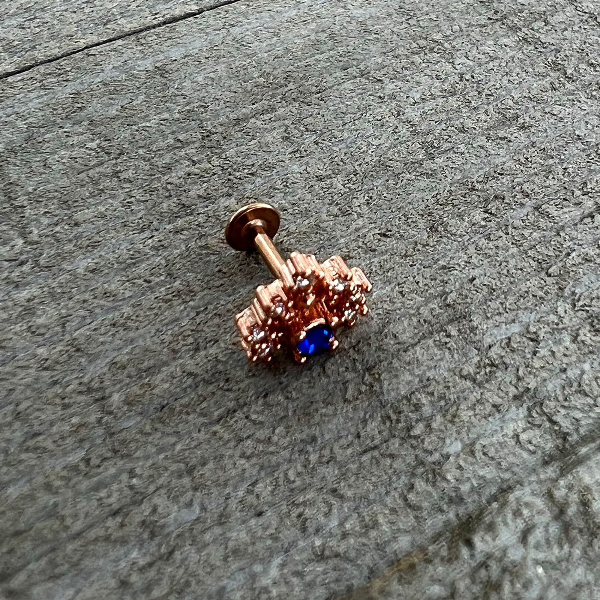 BodyCandy 16G 1/4 Blue Clear Gem Rose Gold Tone Glamour Flare Labret — in-use photo
