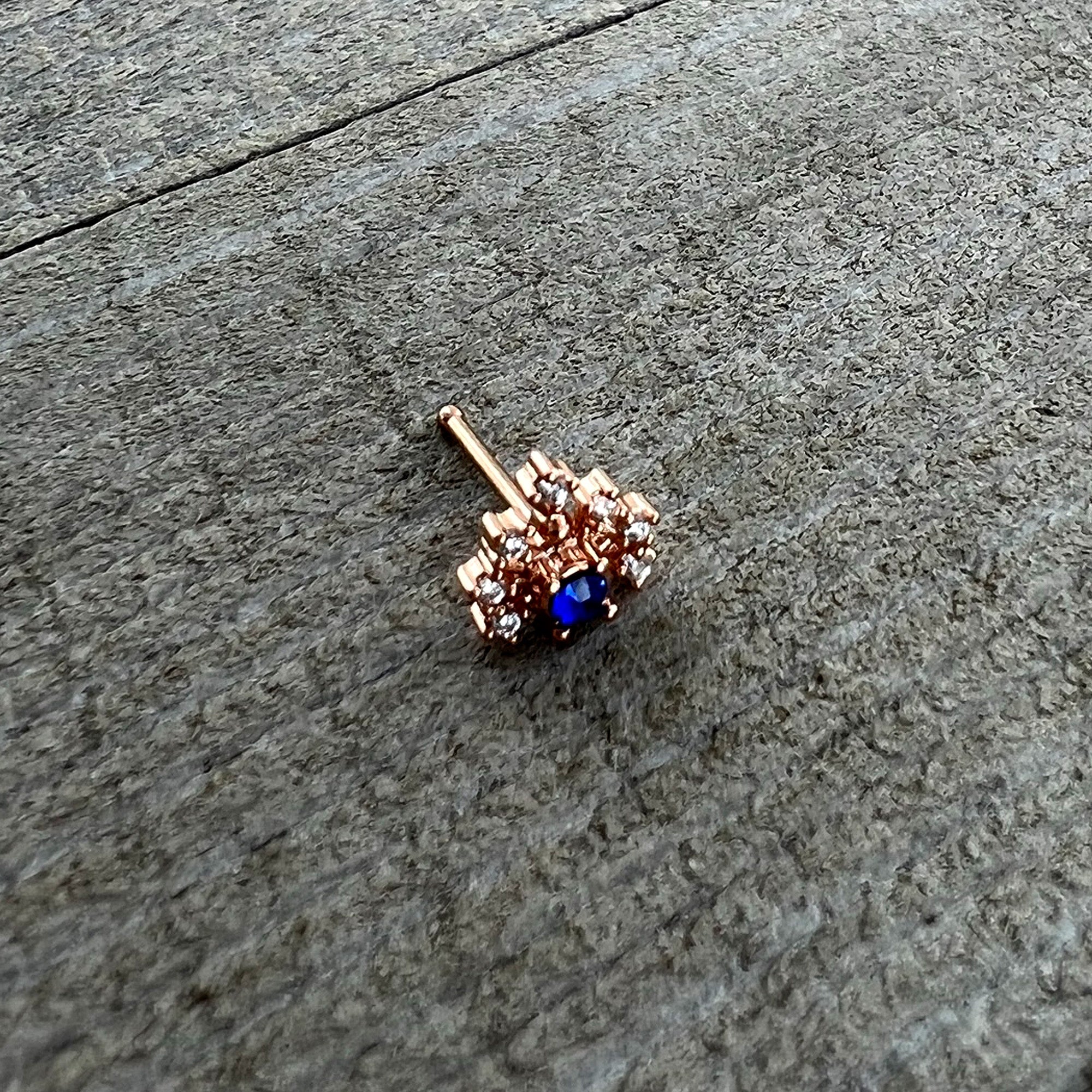 BodyCandy 20G 1/4 Blue Clear Gem Rose Gold Tone Glamour Flare Nose Bone — in-use photo