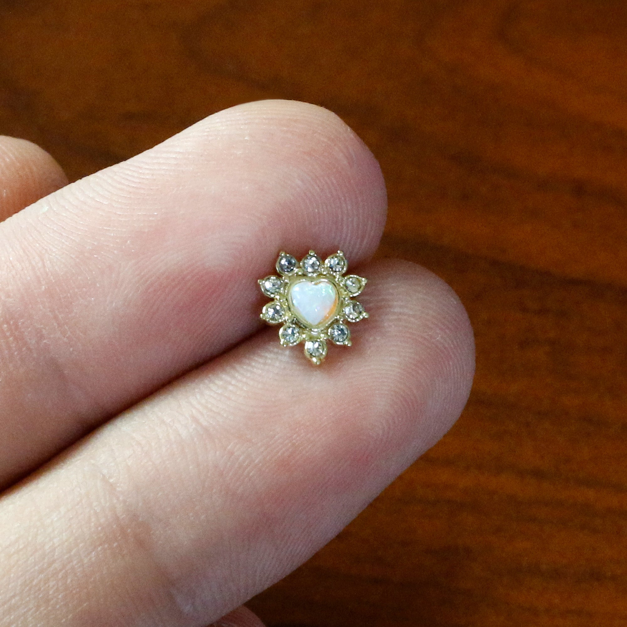 BodyCandy 16G 5/16 White Faux Opal Gold Tone Sun Heart Labret Monroe Tragus — in-use photo