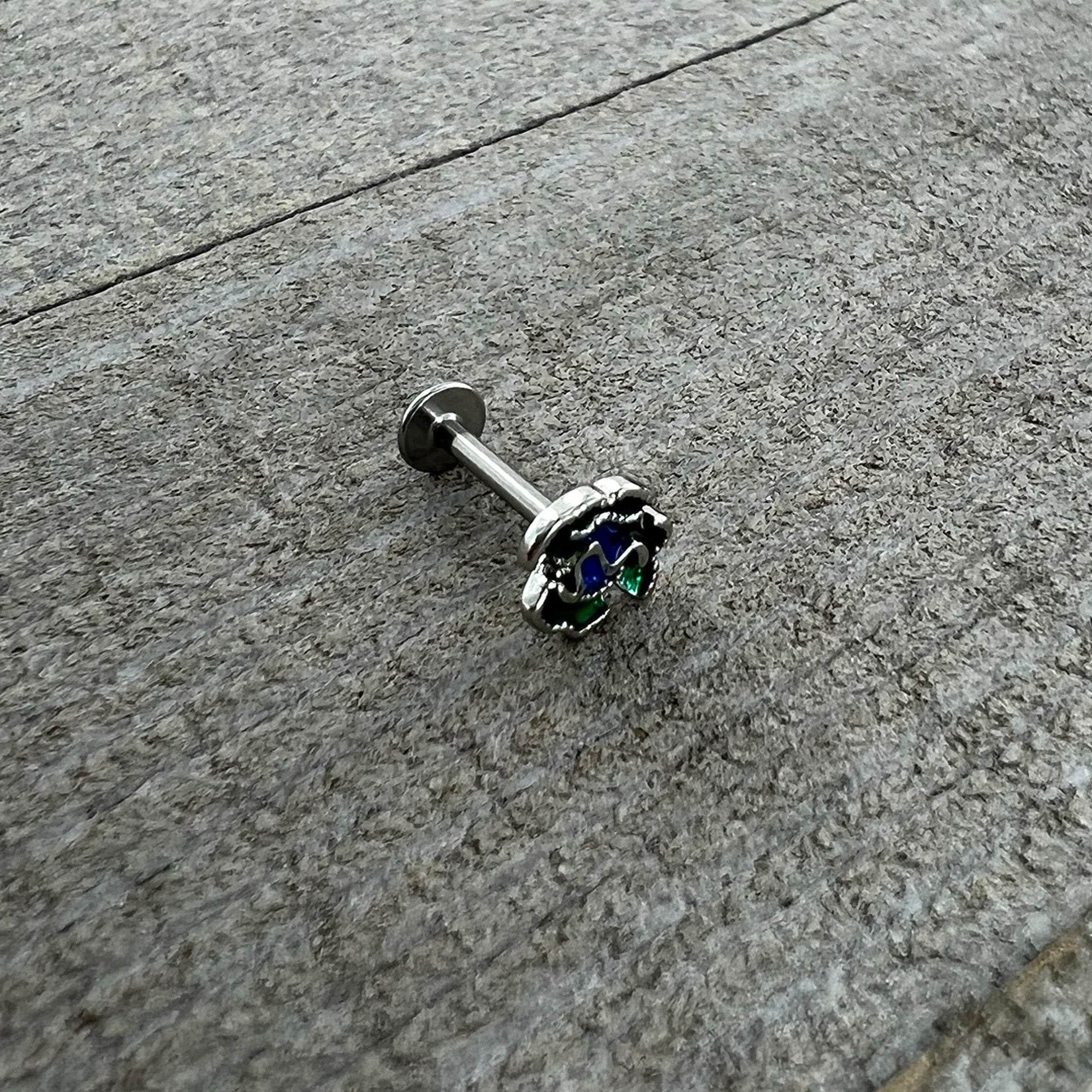 BodyCandy 16G 5/16 Spring Flower Green Blue Labret Monroe Tragus — in-use photo