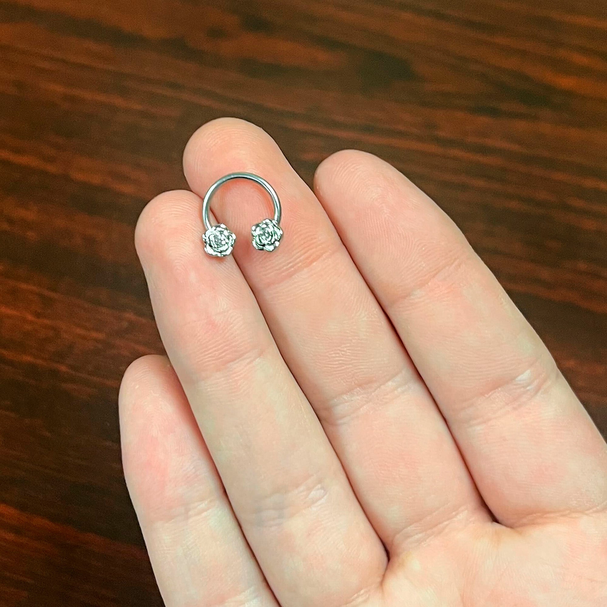 BodyCandy 16G 3/8 Textured Blooming Flowers Horseshoe Circular Barbell — back view