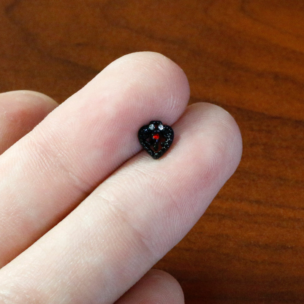 BodyCandy 16G 1/4 Red Clear Gem Black Heart Key Cartilage Tragus Earring — in-use photo