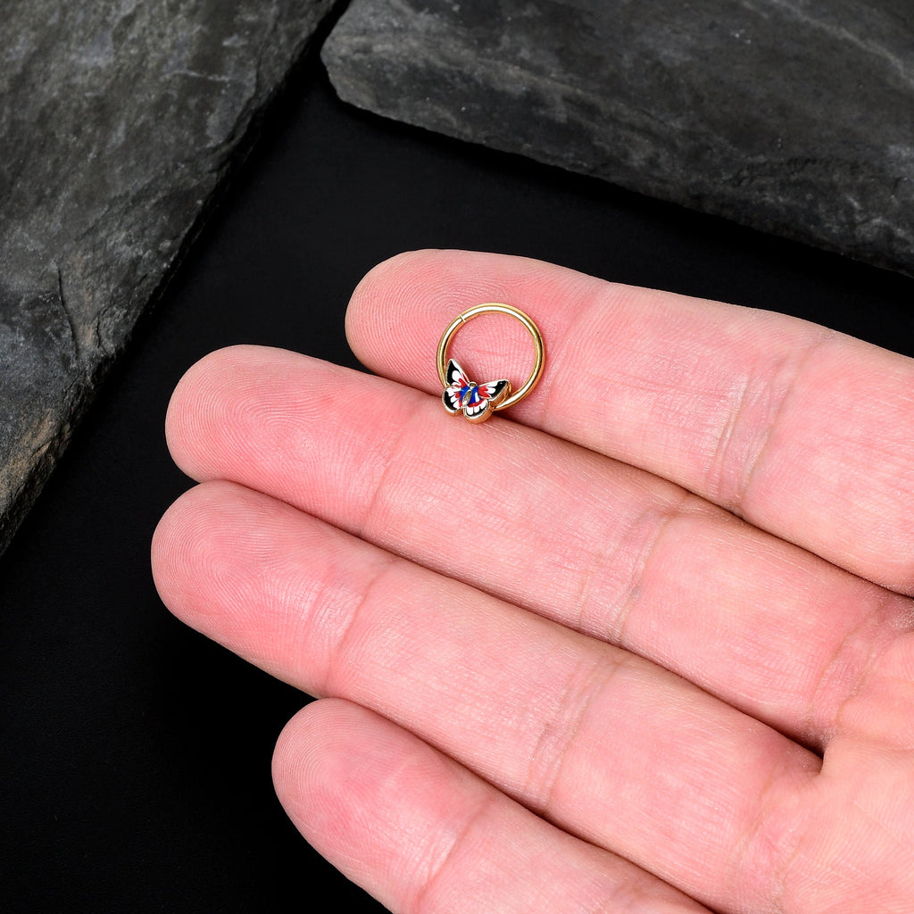 BodyCandy 16G 3/8 Gold Tone Red Pink Blue Butterfly Hinged Segment Ring — in-use photo