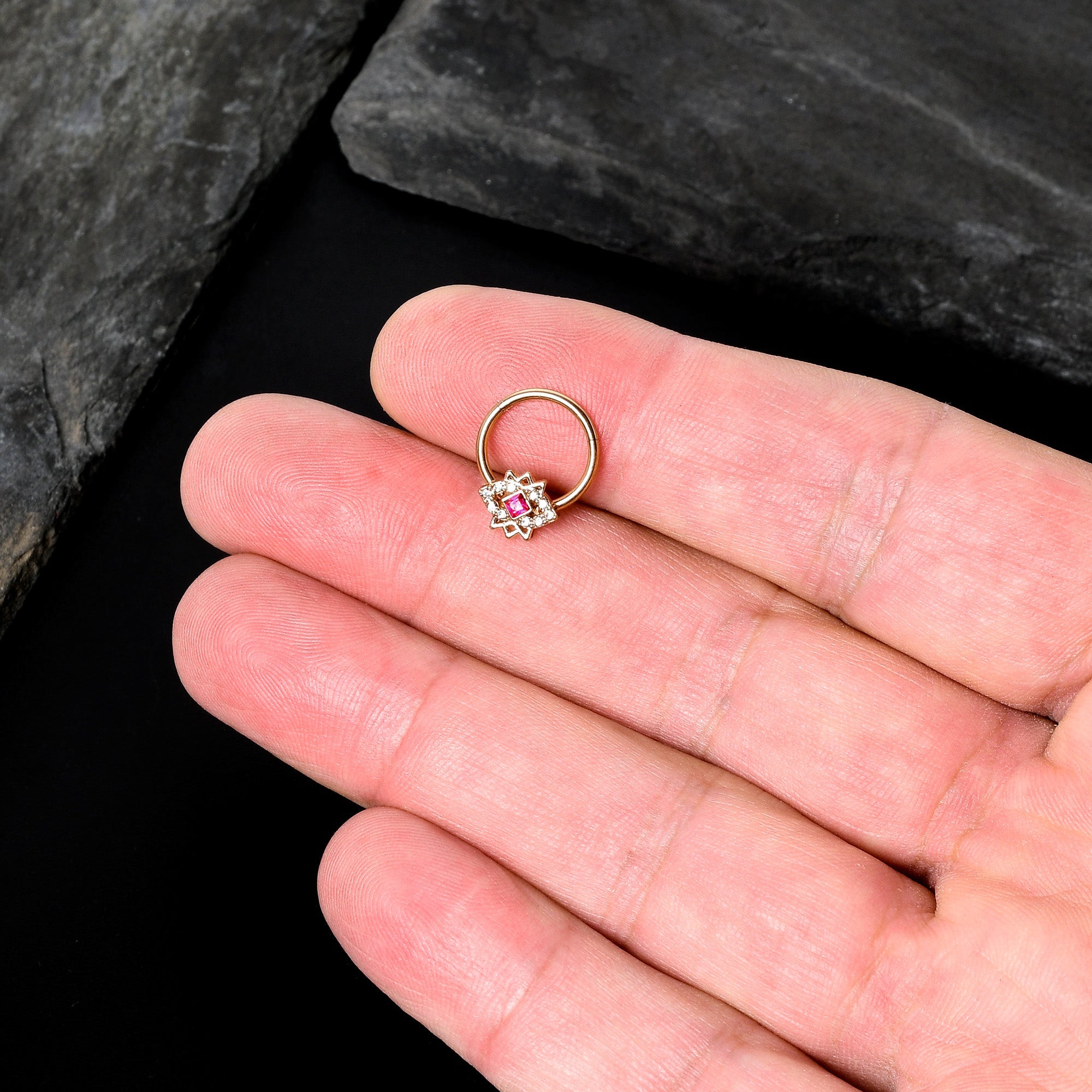 BodyCandy 16G 3/8 Red Gem Rose Gold Tone Octogram Star Hinged Circular Ring — in-use photo