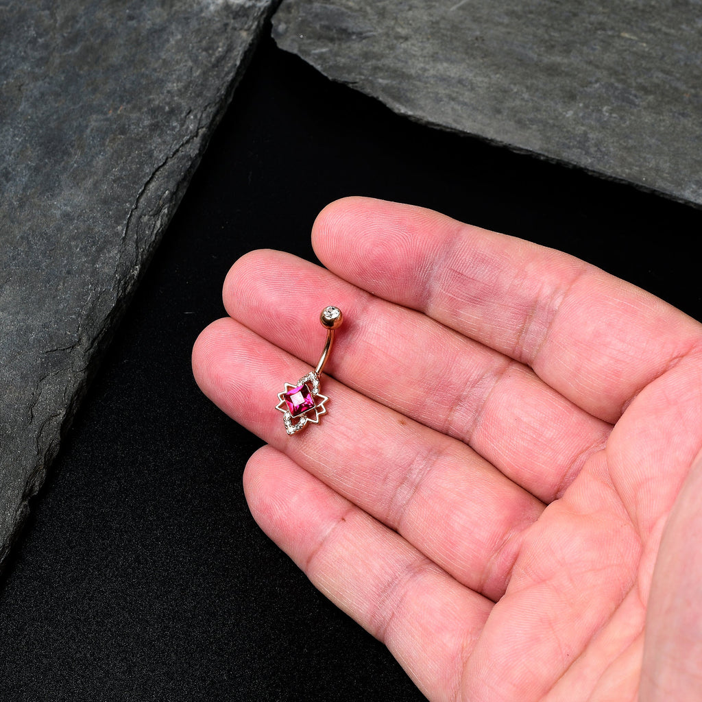 BodyCandy Clear Red Gem Rose Gold Tone Octagram Star Belly Ring — detail close-up