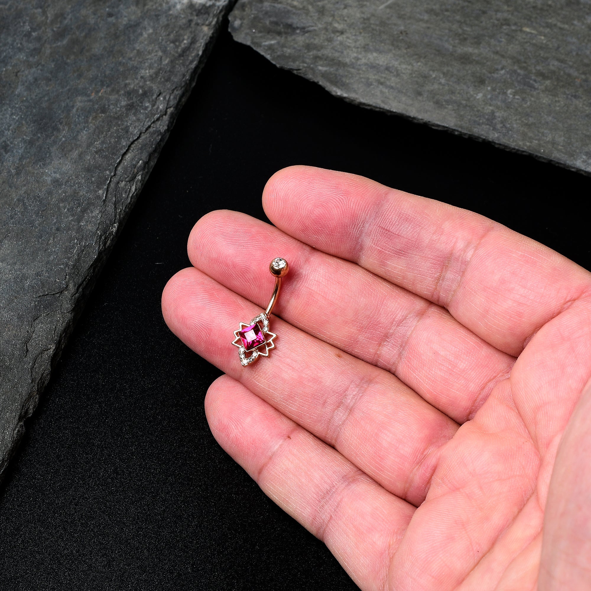 BodyCandy Clear Red Gem Rose Gold Tone Octagram Star Belly Ring — detail close-up