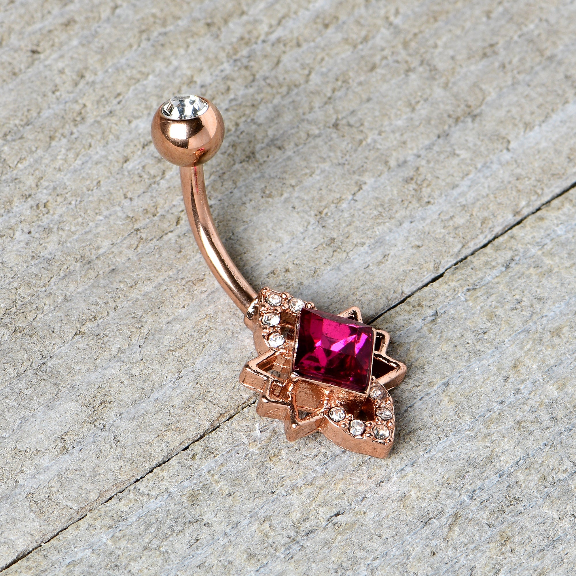 BodyCandy Clear Red Gem Rose Gold Tone Octagram Star Belly Ring — back view