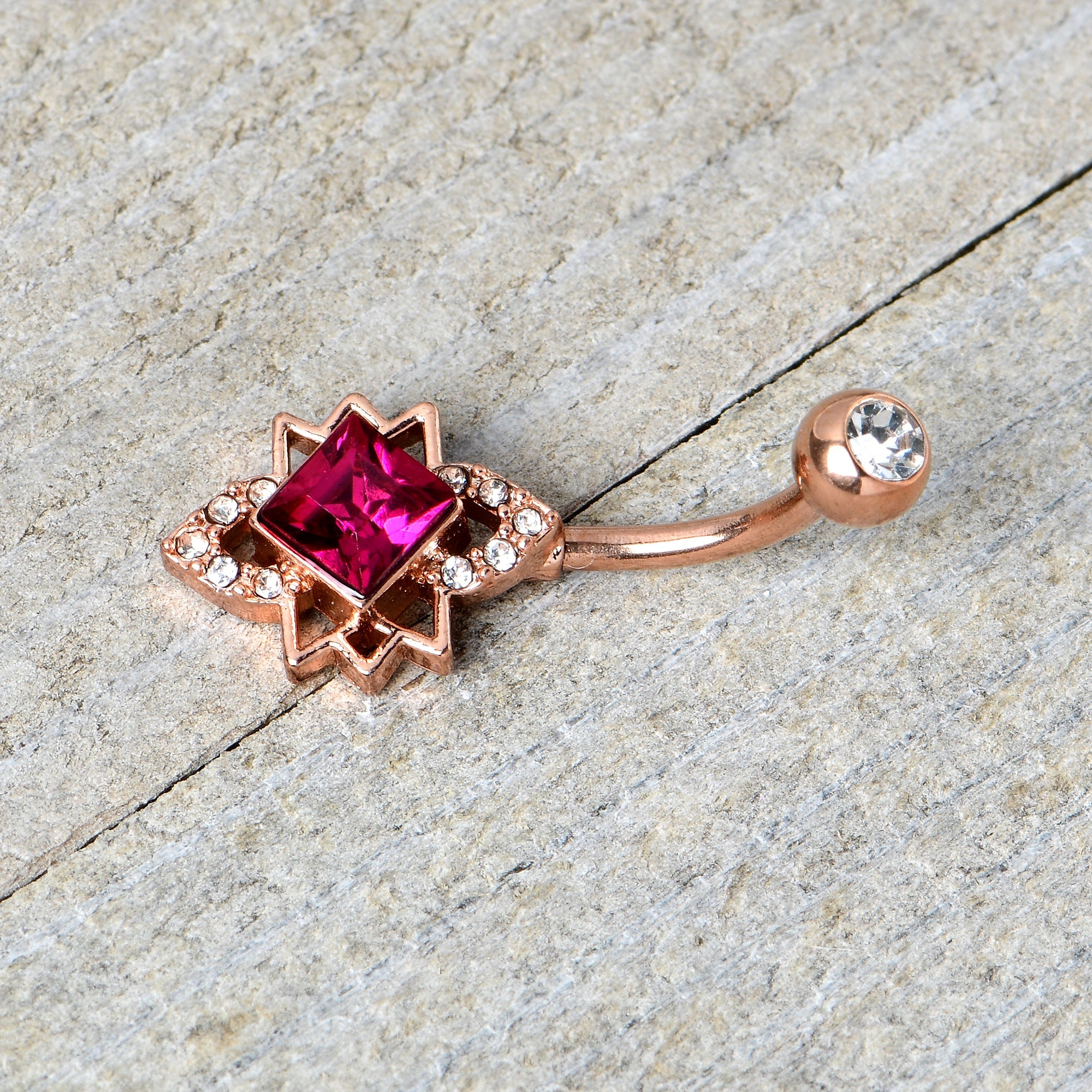 BodyCandy Clear Red Gem Rose Gold Tone Octagram Star Belly Ring — in-use photo