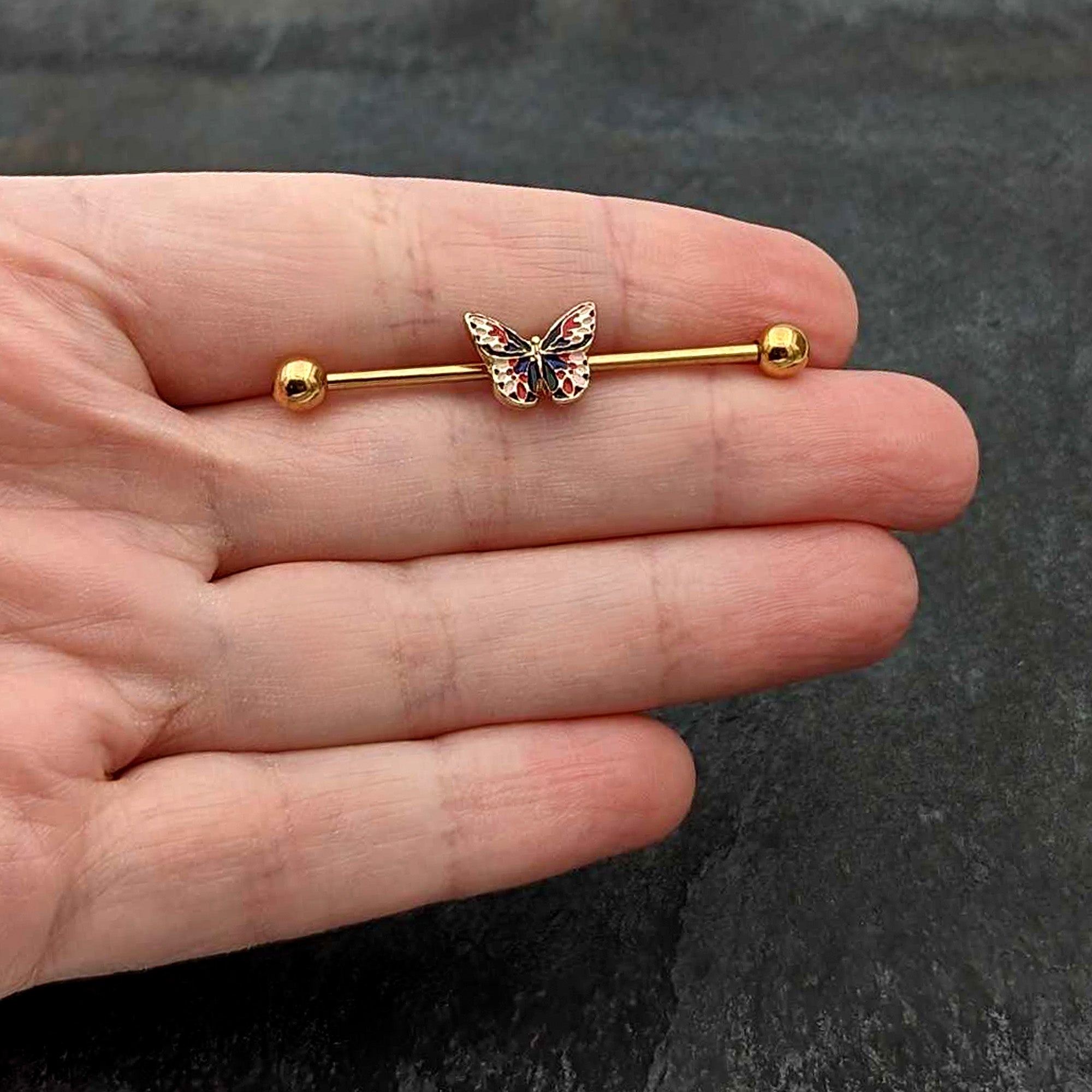 BodyCandy 14G Gold Tone Red Blue Pink Butterfly Industrial Barbell 38mm — in-use photo