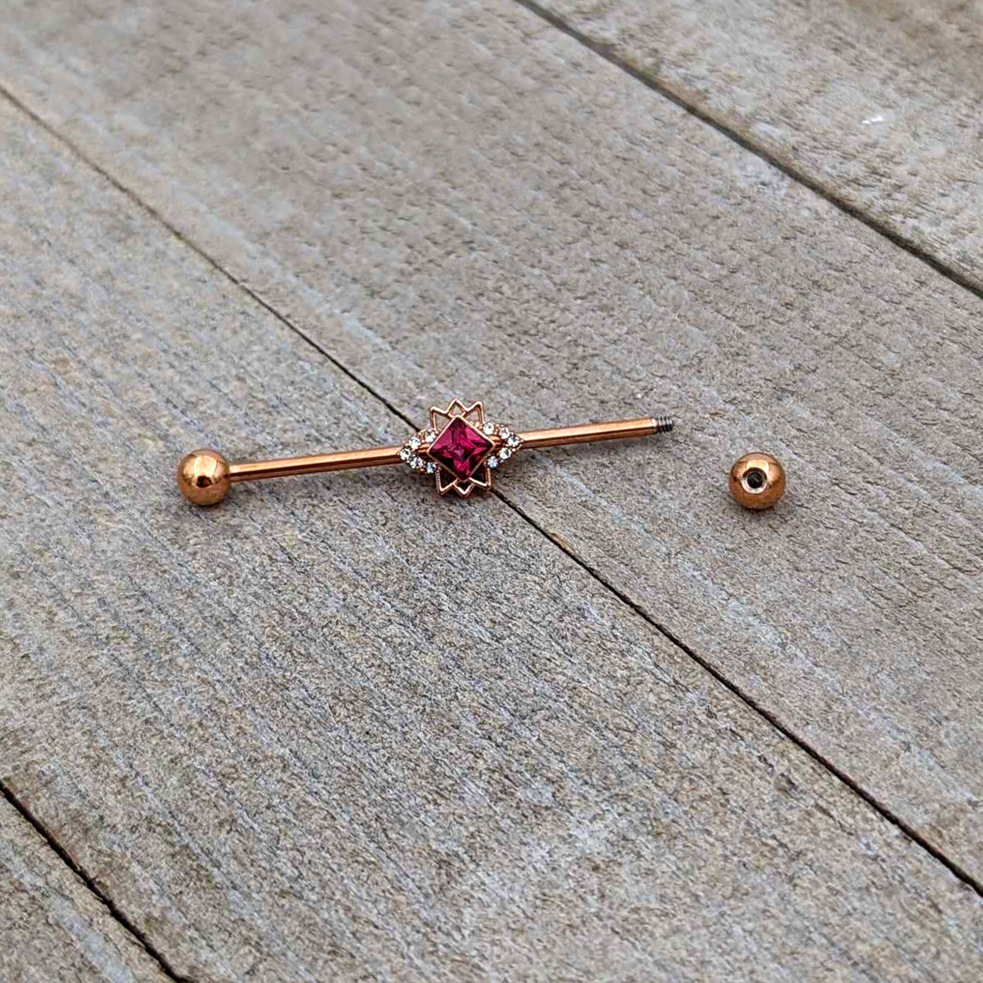 BodyCandy 14G Red Gem Rose Gold Tone Octogram Star Industrial Barbell 38mm — alternative angle